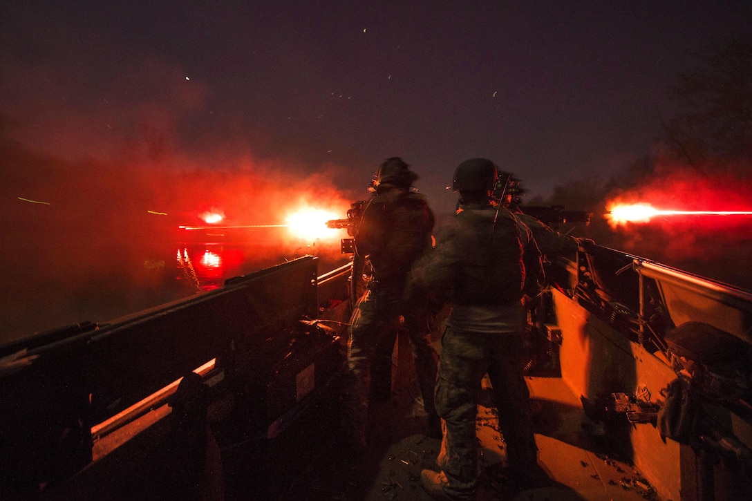 Sailors fire weapons during a live-fire exercise at night while conducting an annual training exercise near Fort Knox, Ky., April 17, 2016. Navy photo by Petty Officer 2nd Class Gabriel Bevan