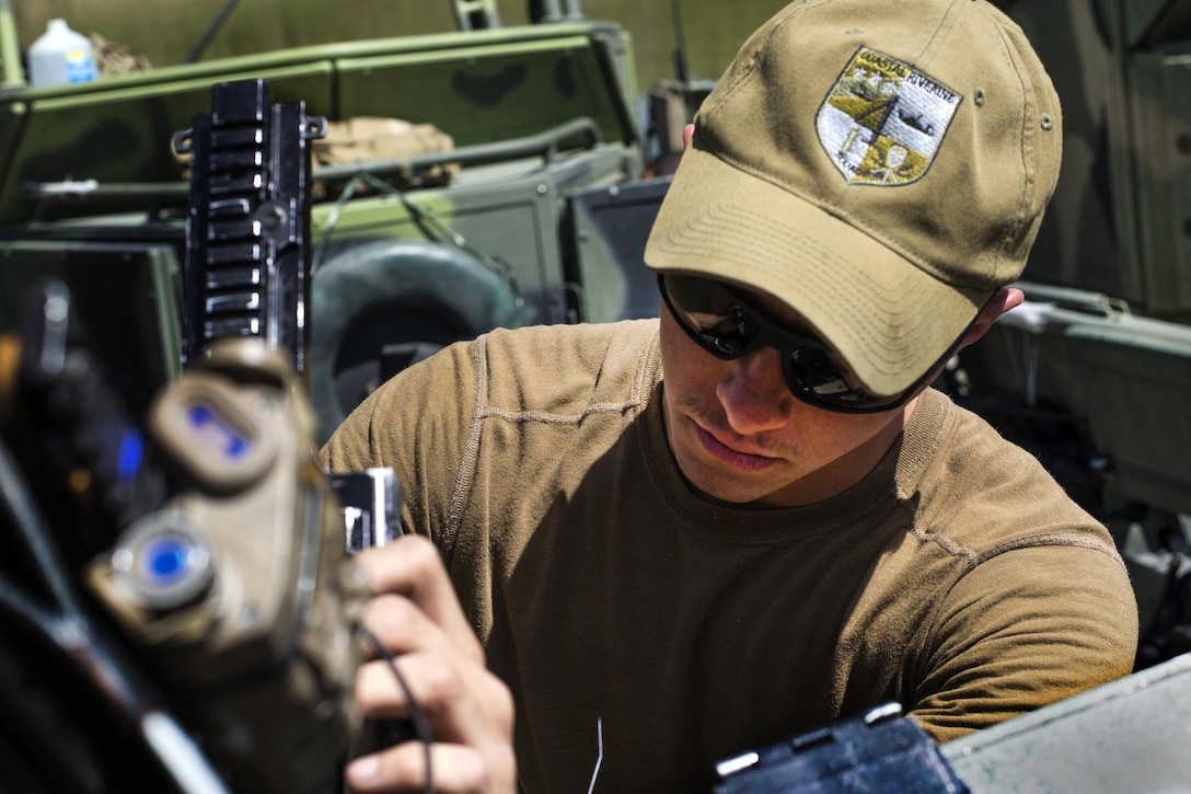 Navy seaman Tyler McComb performs maintenance on an M240 machine gun during an annual training exercise near Fort Knox, Ky., April 18, 2016. McComb is a gunner’s mate assigned to Coastal Riverine Squadron Four. Navy photo by Petty Officer 2nd Class Gabriel Bevan