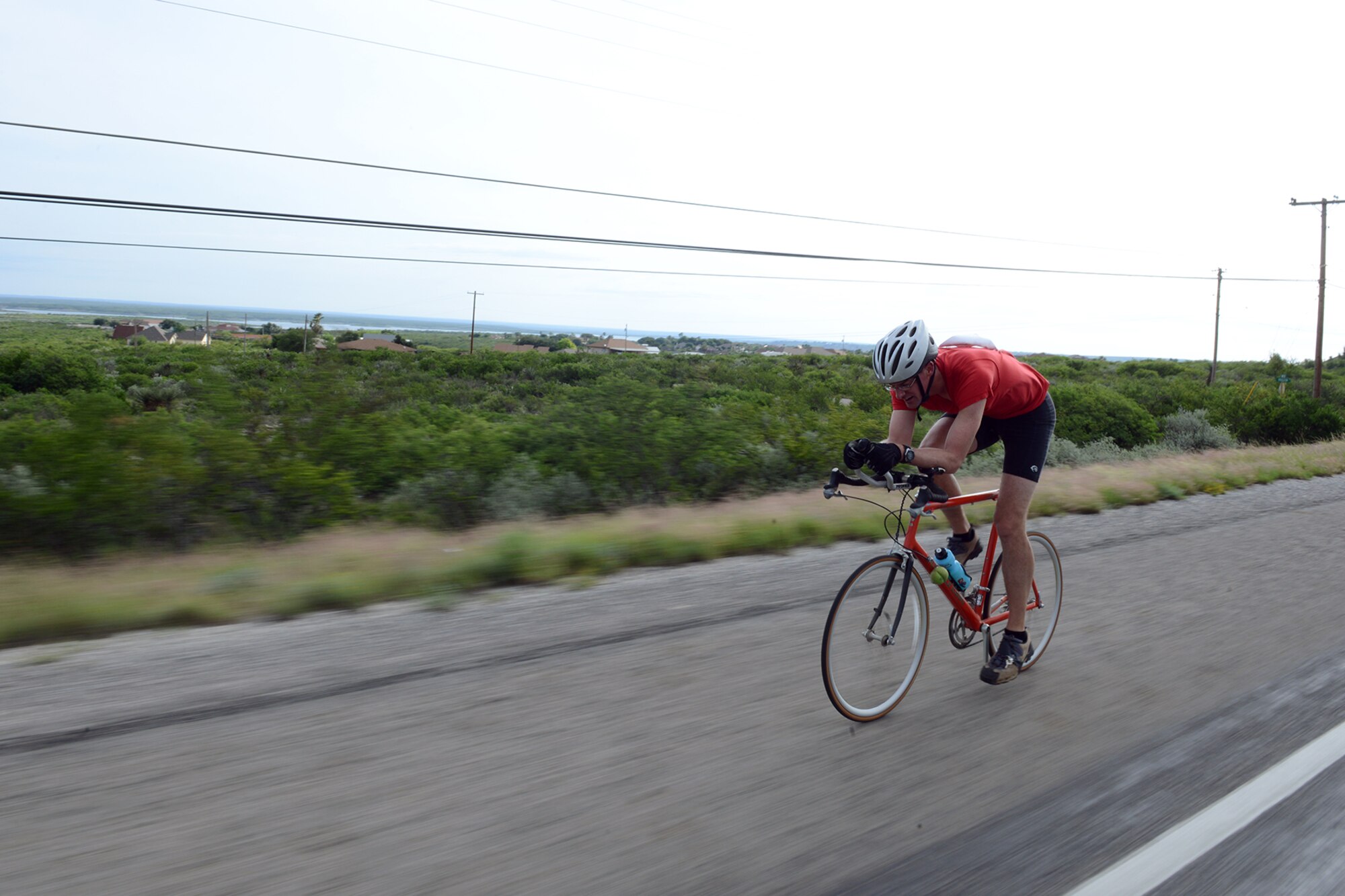 A competitor bikes during Adventure Race XII in Del Rio, Texas, April 23, 2016. The biking portion of the race was a 23-mile stretch from Laughlin AFB to the Laughlin Southwinds Marina off of Lake Amistad. (U.S. Air Force photo by Senior Airman Jimmie D. Pike)