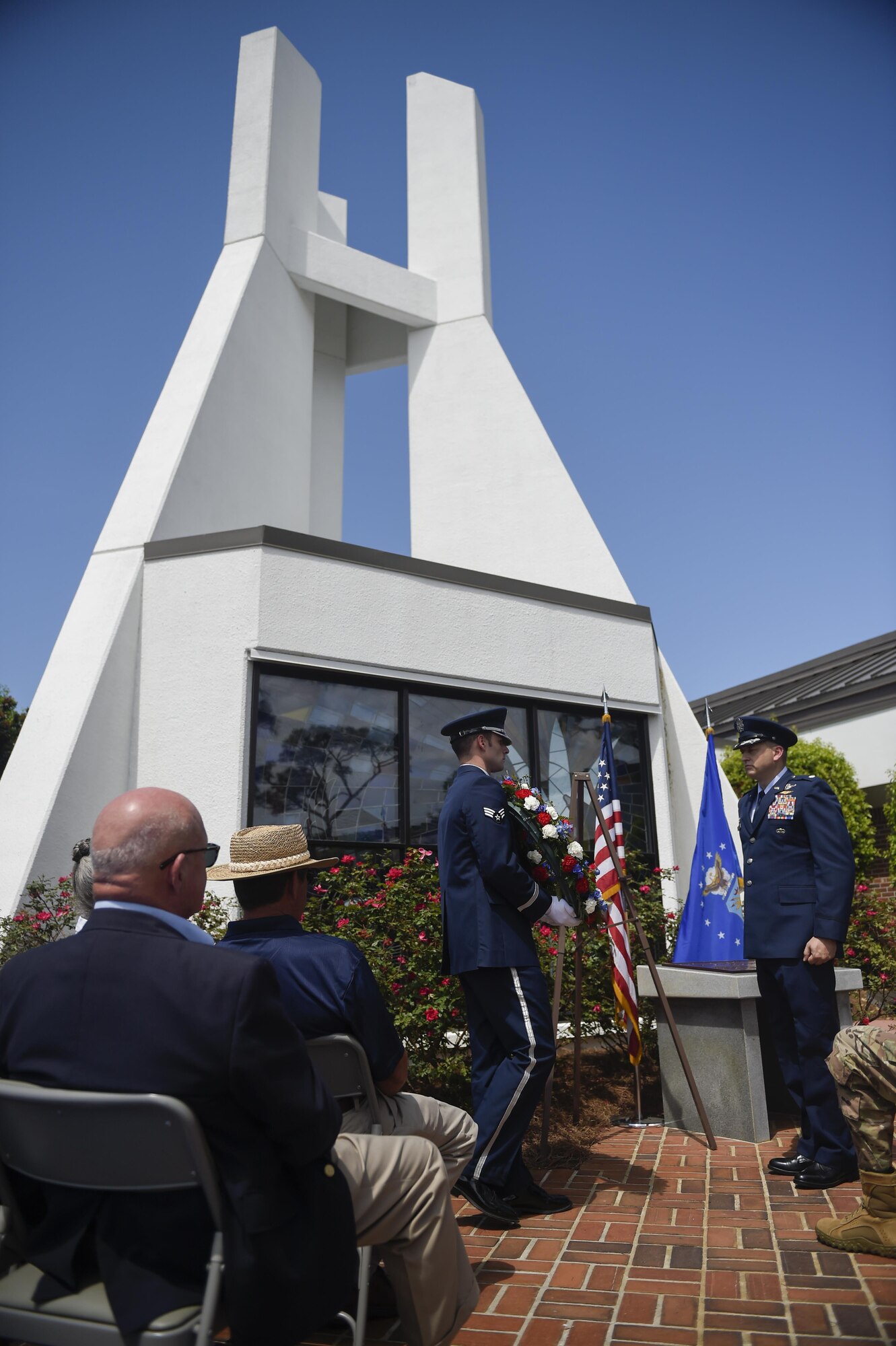 A Hurlburt Field Base Honor Guard member places a wreath during an Operation Eagle Claw memorial ceremony at Hurlburt Field, Fla., April 25, 2016. This year marks the 36th anniversary of the rescue mission in Tehran, Iran, April 24, 1980. The wreath honored Maj. Richard Bakke, Maj. Harold Lewis Jr., Tech. Sgt. Joel C. Mayo, Maj. Lyn McIntosh and Capt. Charles McMillan II, all from the 8th Special Operations Squadron, as well as Marine Sgt. John Harvey, Cpl. George Holmes Jr. and Staff Sgt. Dewey Johnson, who lost their lives during the operation. (U.S. Air Force photo Airman 1st Class Kai White)