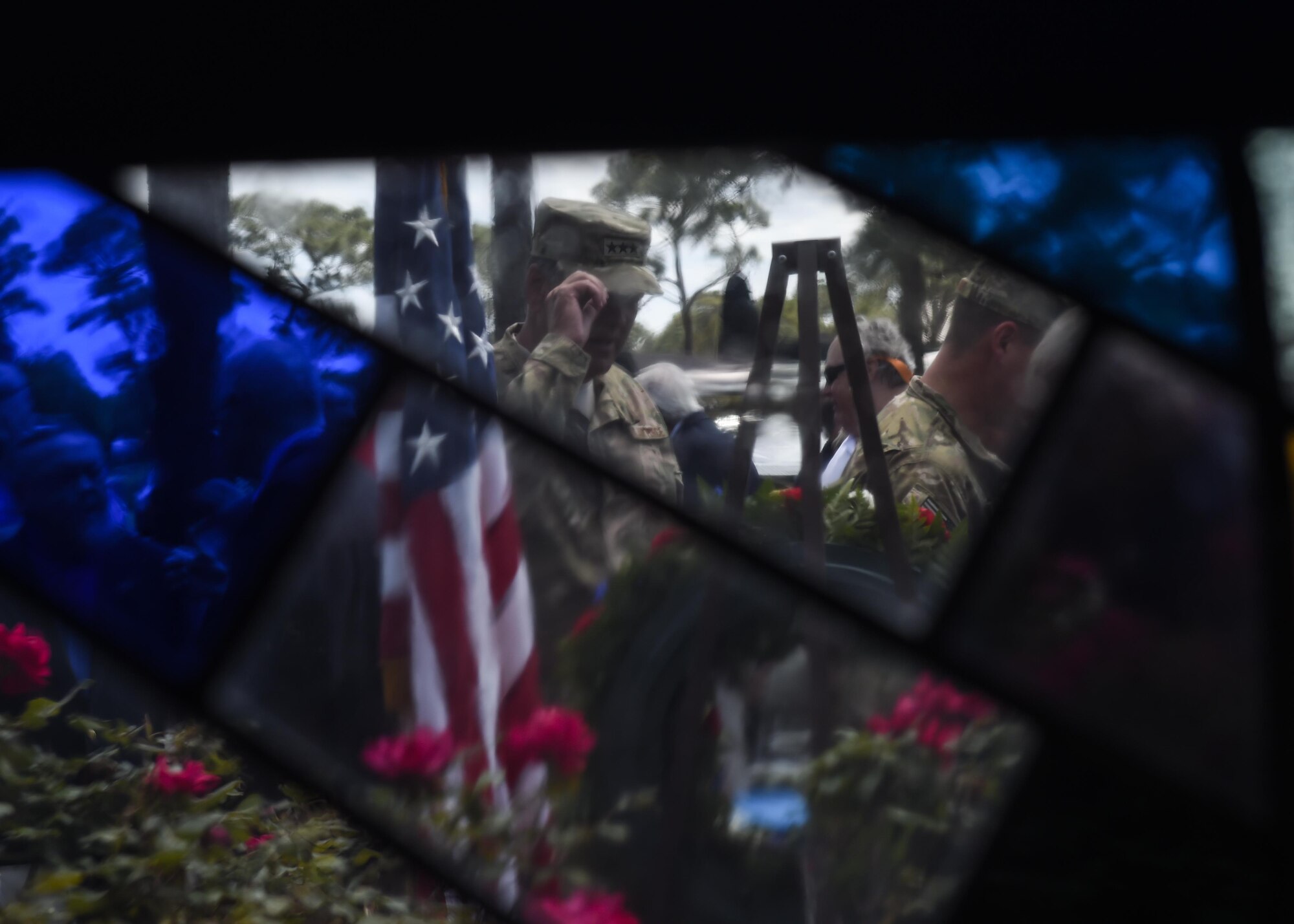Lt. Gen. Bradley Heithold, the commander of Air Force Special Operations Command, pays his respects during a ceremony for the 36th anniversary of Operation Eagle Claw at Hurlburt Field, Fla., April 25, 2016. Operation Eagle Claw, the attempted rescue mission of American hostages from the United States embassy in Iran, ended in disaster at the Desert One refueling site in April 1980. Eight American service members were killed during the mission, resulting in the Holloway Commission to convene and analyze why the mission failed. The recommended corrective actions led to the gradual reorganization and rebirth of United States Special Operations Command in 1987. (U.S. Air Force photo Airman 1st Class Kai White)
