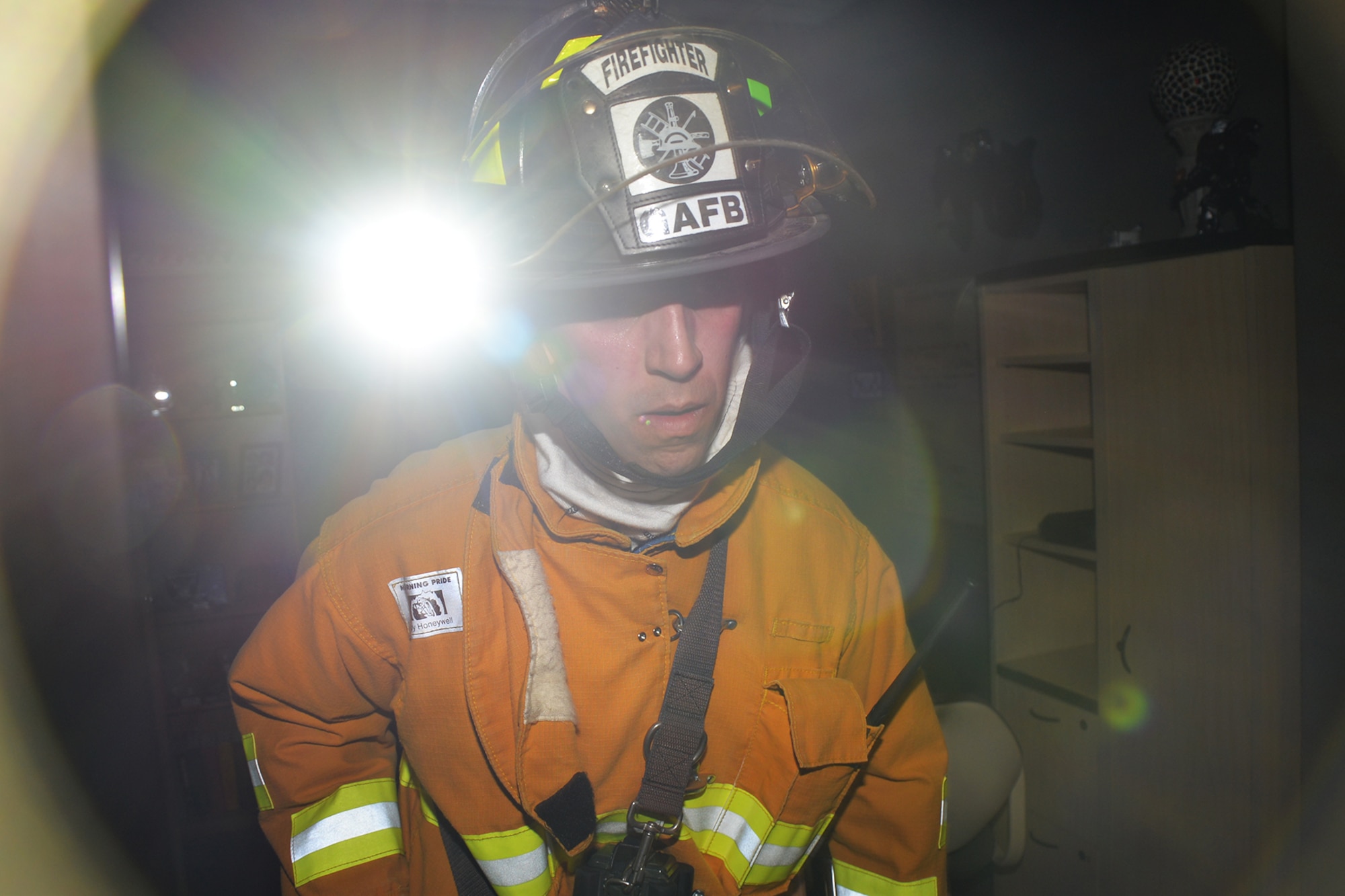Andrew J. Freyhof, 17th Civil engineer Squadron Fire Emergency Services firefighter, searches for simulated victims in Bldg. 533 during a tornado exercise on Goodfellow Air Force Base, Texas, April 26, 2016. The Wing Inspection Team will review the field training exercise to determine the success of how base personnel responded to the emergency. (U.S. Air Force photo by Airman 1st Class Randall A.S. Moose/Released)
