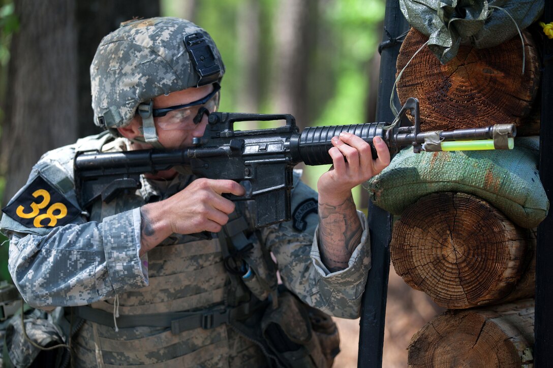 Army Cpl. Scott Slater provides security with his M4 assault rifle  during the Best Ranger Competition at Fort Benning, Ga., April 16, 2016. Slater is assigned to the 75th Ranger Regiment. Army photo by Sgt. Austin Berner