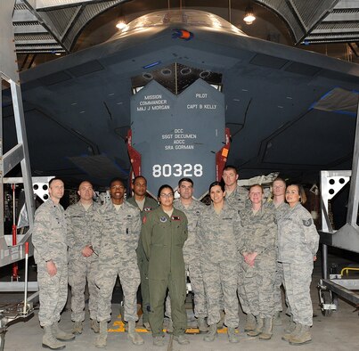 Members of the 90th Missile Wing (MW) at F.E. Warren Air Force Base (AFB), Wyo., pose for a group photo in front of a B-2 Spirit at Whiteman AFB, Mo., April 14, 2016. The 90th MW and the 509th and 131st Bomb Wings are participating in a “sister-base” partnership, officially named the Bomber Missile Exchange Course, which allows the organizations to learn from each other through scheduled visits. 