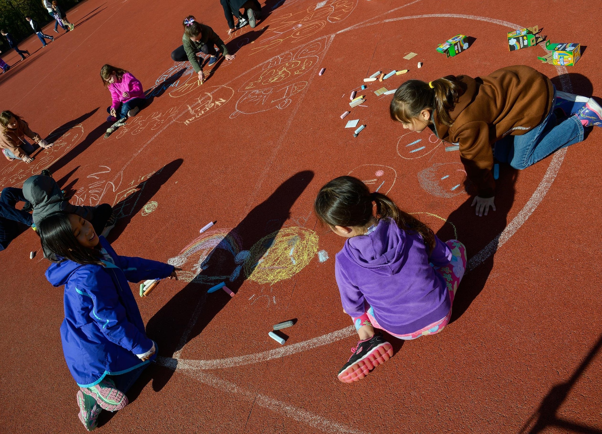 Children from Vogelweh Elementary School draw out their emotions during a therapy session April 21, 2016, at Vogelweh Air Base, Germany. Dozens of families recently separated from service members in Turkey and now live in the Kaiserslautern military community. (U.S. Air force photo/Airman 1st Class Lane T. Plummer) 
