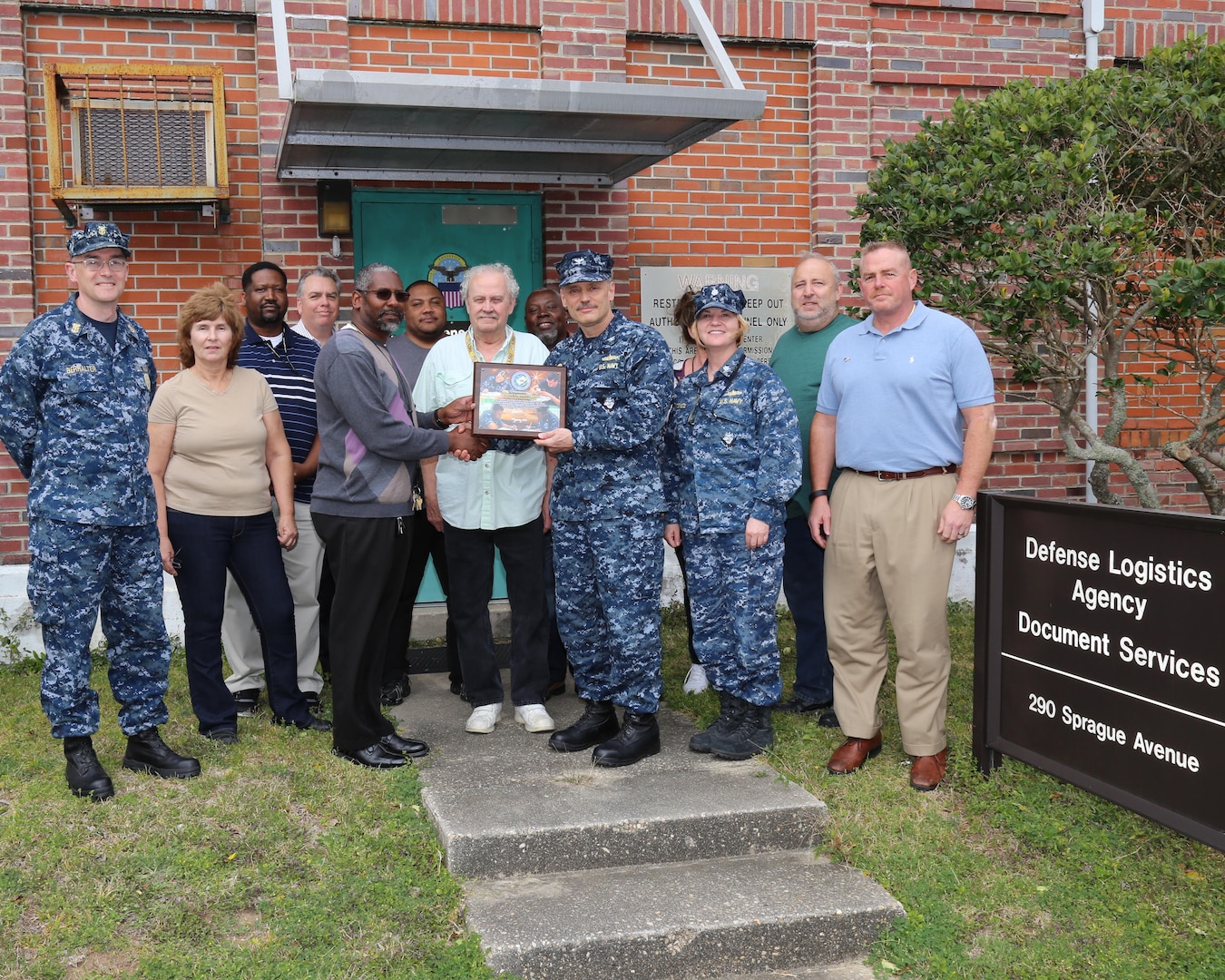 Front, from left: Command Master Chief James Berhalter, NETPDTC; Deborah Robbins, DLA; Michael Rivers, DLA; Mike Spinks, DLA; Capt. Lee Newton, NETPDTC; Cdr. Brenda Stencil, NETPDTC; James Larkin, NETPDTC.

Back, from left: Orlando Grimsley, DLA; Tom Updike, NETPDTC; Tyrone Henderson, DLA; George Terrell, DLA; Eleonore Croazzo, DLA; Charles Matthews, DLA.
