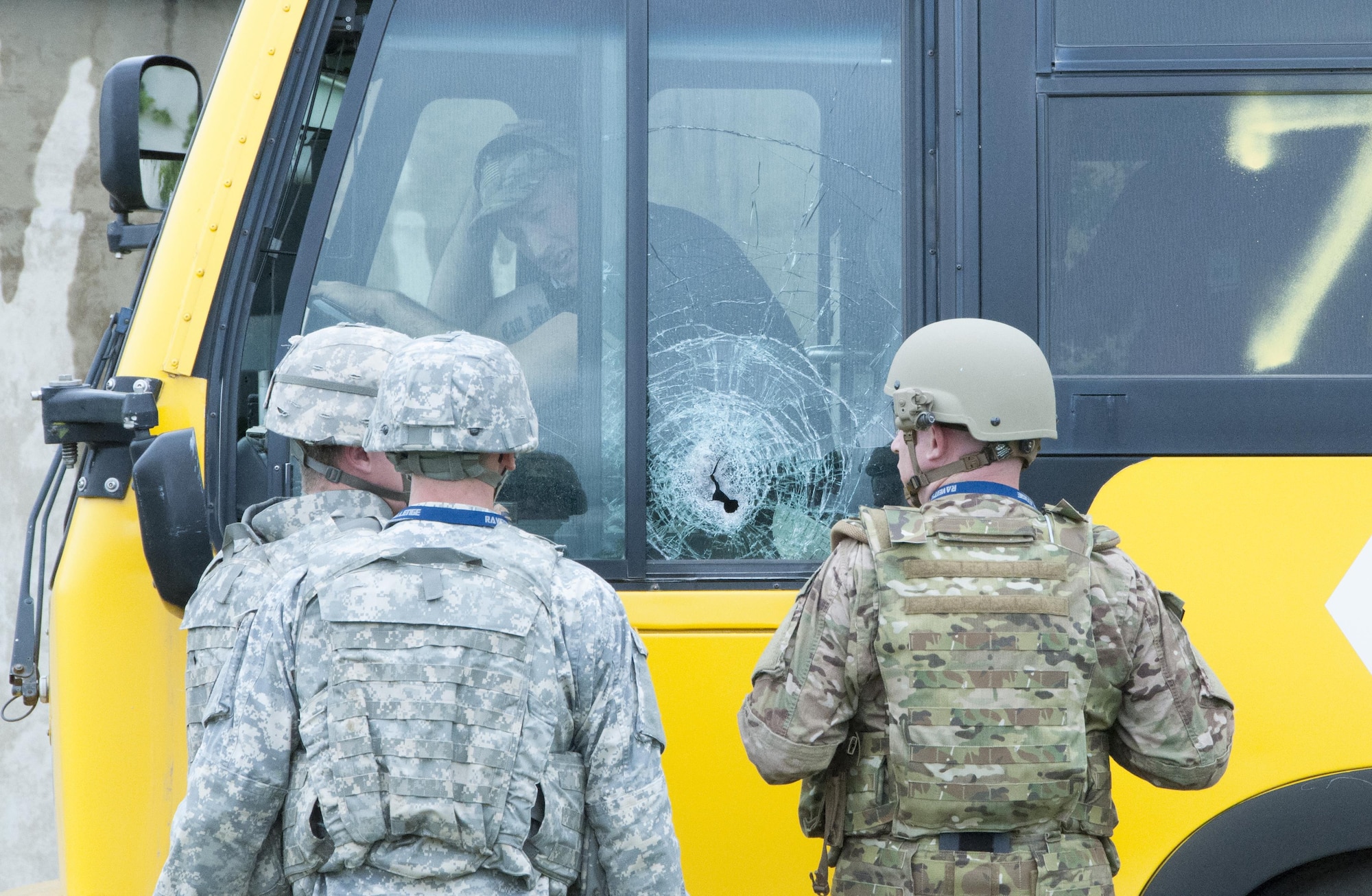 An Air Force Reserve and two Army explosive ordnance disposal technicians talk to a hostage during Raven’s Challenge X exercise April 20 at Fort Wolters, Texas. The exercise gives military EOD technicians, public safety bomb squads, and other government agencies the opportunity to merge their resources and perform counter-IED operations together in a realistic training environment. The exercise occurs in four locations across the country, which makes it the largest in the world of its kind. (U.S. Air Force photo by Staff Sgt. Melissa Harvey)