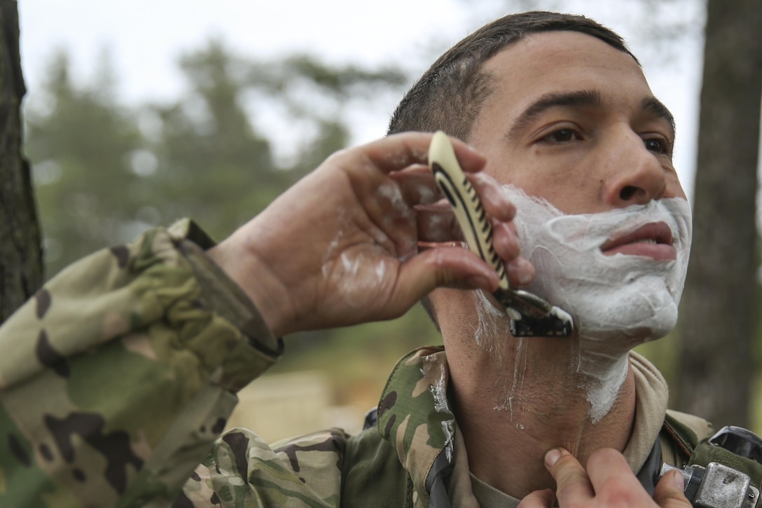 A soldier shaves his face while during exercise Saber Junction 16 at the U.S. Army’s Joint Multinational Readiness Center in Hohenfels, Germany, April 18, 2016. Army photo by Sgt. Seth Plagenza