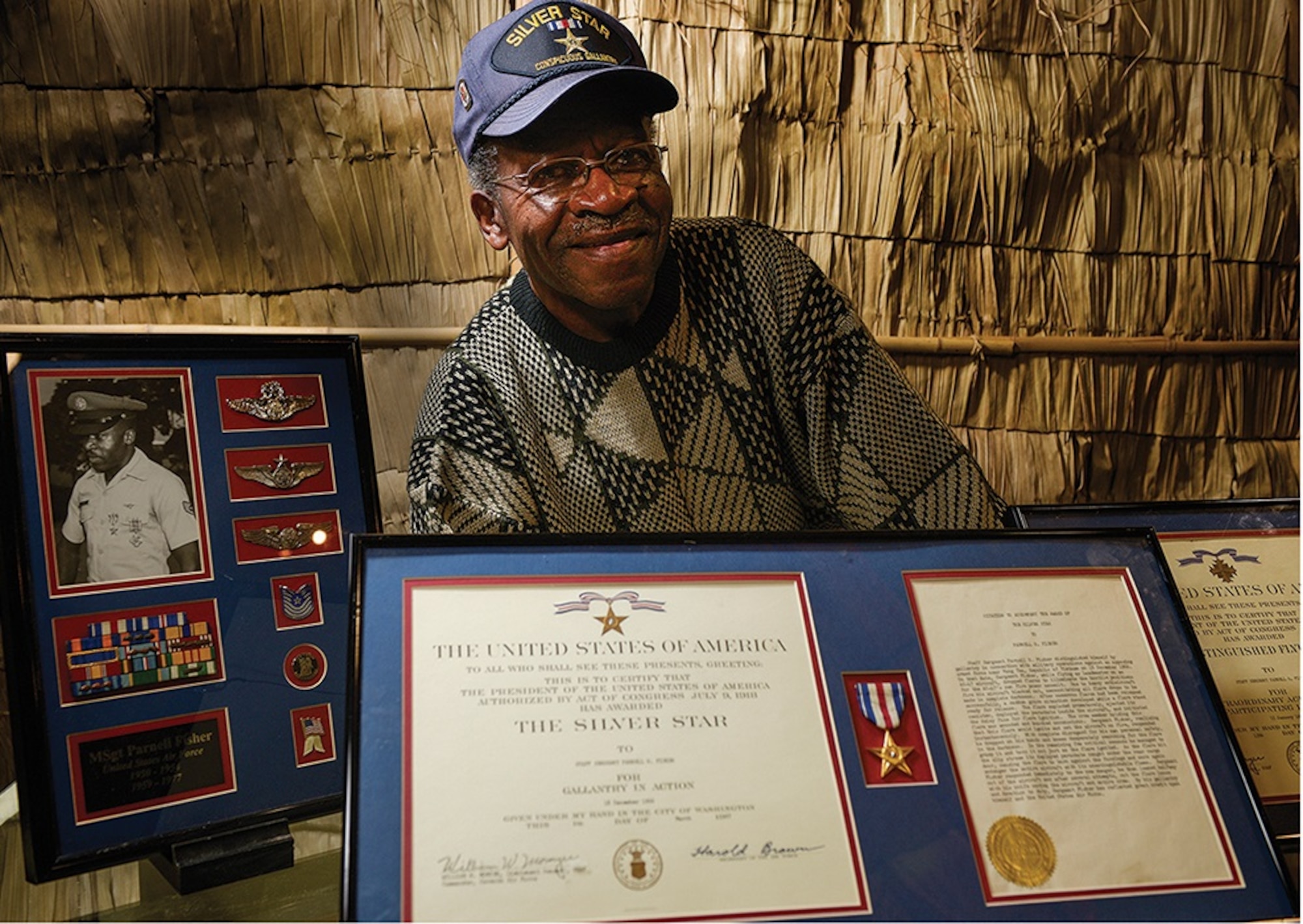 Master Sergeant (Ret.) Parnell Fisher is a decorated war veteran, serving 22 years as an Air Force loadmaster.  He first served from 1950 to 1954 and, after earning a bachelor’s degree in the ensuing years, served again from 1959 to 1977.  He was awarded a Silver Star for gallant actions on Dec. 18, 1966, while aboard an AC-47 Spooky, over Vung Tau, Vietnam.  During the routine mission, Fisher saved the life of the crew by tossing out a prematurely exploded flare from the aircraft.  Fisher and the flight engineer were handling 22-pound flares, set to go off on a timer.  As the engineer picked up a flare, it unexpectedly ignited.  The chute went out and knocked him unconscious.  “I get to the flare, go to the doorway and throw the dang thing out,” Fisher said.  Thinking he had averted disaster, Fisher was distressed to see the flare’s chute hanging onto the edge of the plane’s cargo door.  He feverishly cut at the attached cords, fighting to snip the tightly wound strings clutching to the cargo door and threatening the lives of the crew.  Fisher was able to cut the flare’s chute loose just in time, severing the lines and looking on as the flare exploded outside seconds later.