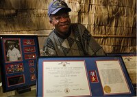 Master Sergeant (Ret.) Parnell Fisher is a decorated war veteran, serving 22 years as an Air Force loadmaster.  He first served from 1950 to 1954 and, after earning a bachelor’s degree in the ensuing years, served again from 1959 to 1977.  He was awarded a Silver Star for gallant actions on Dec. 18, 1966, while aboard an AC-47 Spooky, over Vung Tau, Vietnam.  During the routine mission, Fisher saved the life of the crew by tossing out a prematurely exploded flare from the aircraft.  Fisher and the flight engineer were handling 22-pound flares, set to go off on a timer.  As the engineer picked up a flare, it unexpectedly ignited.  The chute went out and knocked him unconscious.  “I get to the flare, go to the doorway and throw the dang thing out,” Fisher said.  Thinking he had averted disaster, Fisher was distressed to see the flare’s chute hanging onto the edge of the plane’s cargo door.  He feverishly cut at the attached cords, fighting to snip the tightly wound strings clutching to the cargo door and threatening the lives of the crew.  Fisher was able to cut the flare’s chute loose just in time, severing the lines and looking on as the flare exploded outside seconds later.