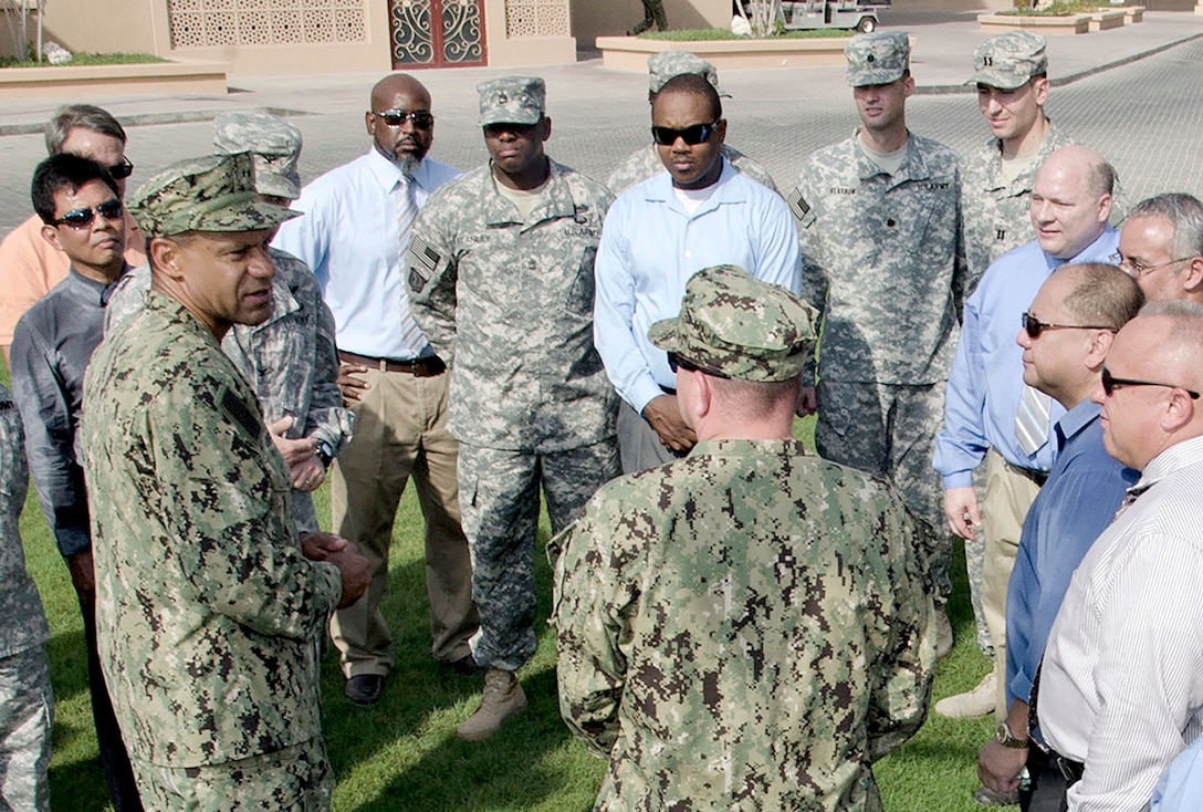 Navy Rear Adm. Vincent L. Griffith visits with DLA personnel at Naval Support Activity Bahrain during a recent visit to the Middle East.