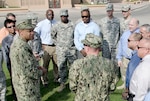 Navy Rear Adm. Vincent L. Griffith visits with DLA personnel at Naval Support Activity Bahrain during a recent visit to the Middle East.