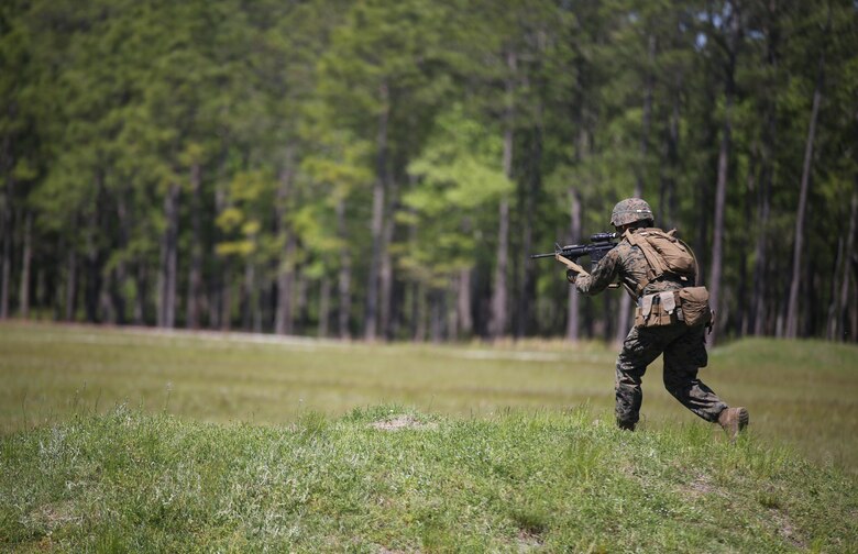 Pfc. Jacob T. Witt, a machine gunner with Kilo Company, 3rd Battalion, 8th Marine Regiment, moves down range during a fire-team attack exercise as part of the battalion field exercise at Camp Lejeune, N.C., April 26, 2016. The FEX, now in its final week of operations, previously tested Marines on basic infantry fundamentals such as patrolling and land navigation. (U.S. Marine Corps photo by Cpl. Paul S. Martinez/Released)