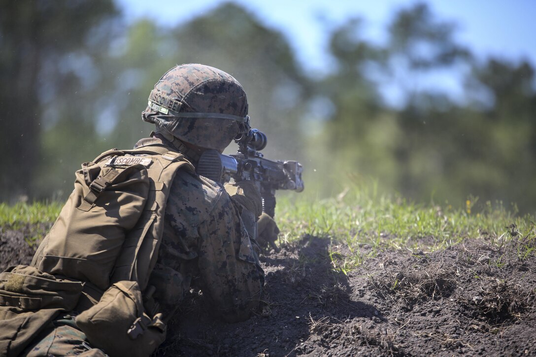 Pfc. Adam J. Wiscombe, a rifleman with Kilo Company, 3rd Battalion, 8th Marine Regiment, engages targets down range during a fire team attack exercise as part of the battalion field exercise at Camp Lejeune, N.C., April 26, 2016. The FEX, now in its final week of operations, previously tested Marines on basic infantry fundamentals such as patrolling and land navigation. (U.S. Marine Corps photo by Cpl. Paul S. Martinez/Released)