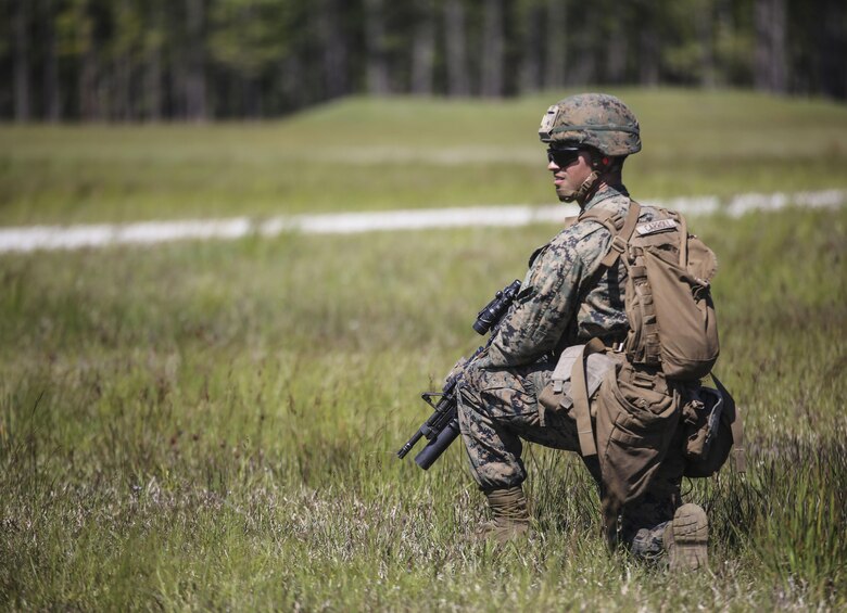 Lance Cpl. Israel B. Carroll, a rifleman with Kilo Company, 3rd Battalion, 8th Marine Regiment, prepares to engage targets down range during a fire-team attack exercise as part of the battalion field exercise at Camp Lejeune, N.C., April 26, 2016. The unit is slated to conduct a training package at Marine Corps Mountain Warfare Training Center Bridgeport, Calif., in the coming months. (U.S. Marine Corps photo by Cpl. Paul S. Martinez/Released)
