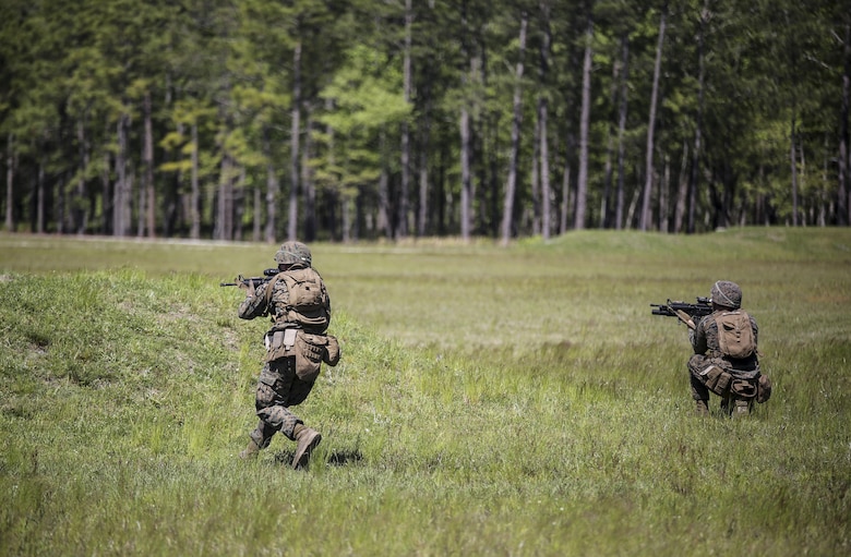 Marines with Kilo Company, 3rd Battalion, 8th Marine Regiment assault targets down range during a fire-team attack exercise as part of the battalion field exercise at Camp Lejeune, N.C., April 26, 2016. The FEX, now in the final week of operations, previously tested Marines on basic infantry fundamentals such as patrolling and land navigation. (U.S. Marine Corps photo by Cpl. Paul S. Martinez/Released)