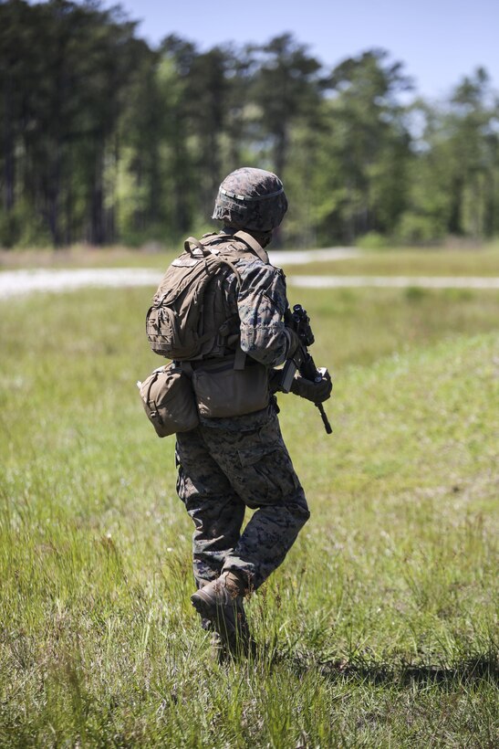 Pfc. Esteban S. Tirado, a machine gunner with Kilo Company, 3rd Battalion, 8th Marine Regiment, moves down range during a fire-team attack exercise as part of the battalion field exercise at Camp Lejeune, N.C., April 26, 2016. The unit is slated to conduct a training package at Marine Corps Mountain Warfare Training Center Bridgeport, Calif., in the coming months. (U.S. Marine Corps photo by Cpl. Paul S. Martinez/Released)