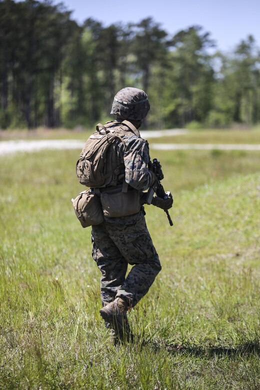 Pfc. Esteban S. Tirado, a machine gunner with Kilo Company, 3rd Battalion, 8th Marine Regiment, moves down range during a fire-team attack exercise as part of the battalion field exercise at Camp Lejeune, N.C., April 26, 2016. The unit is slated to conduct a training package at Marine Corps Mountain Warfare Training Center Bridgeport, Calif., in the coming months. (U.S. Marine Corps photo by Cpl. Paul S. Martinez/Released)