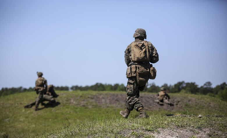 Pfc. Adam J. Wiscombe, a rifleman with Kilo Company, 3rd Battalion, 8th Marine Regiment, rushes down range during a fire-team attack exercise as part of the battalion field exercise at Camp Lejeune, N.C., April 26, 2016. The FEX, now in the final week of operations, previously tested Marines on basic infantry fundamentals such as patrolling and land navigation. (U.S. Marine Corps photo by Cpl. Paul S. Martinez/Released)