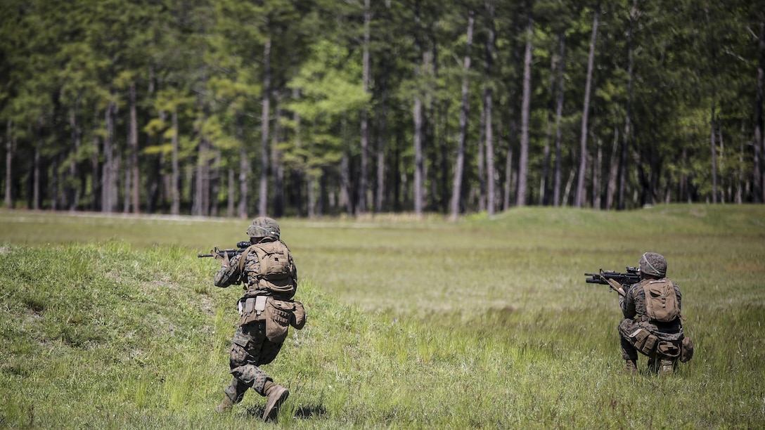 Marines with Kilo Company, 3rd Battalion, 8th Marine Regiment assault targets down range during a fire-team attack exercise as part of the battalion field exercise at Marine Corps Base Camp Lejeune, North Carolina, April 26, 2016. The FEX, now in the final week of operations, previously tested Marines on basic infantry fundamentals such as patrolling and land navigation.