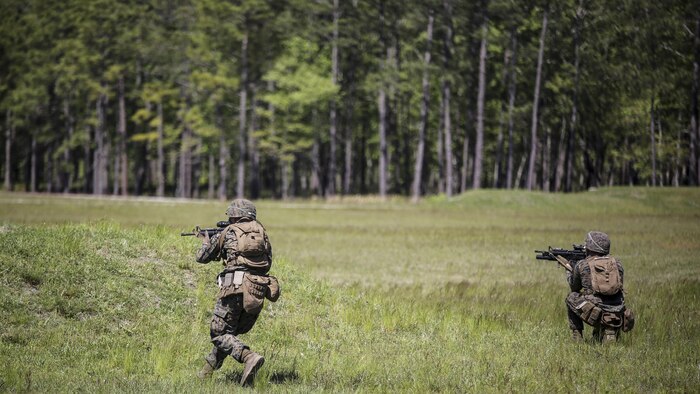 Marines with Kilo Company, 3rd Battalion, 8th Marine Regiment assault targets down range during a fire-team attack exercise as part of the battalion field exercise at Marine Corps Base Camp Lejeune, North Carolina, April 26, 2016. The FEX, now in the final week of operations, previously tested Marines on basic infantry fundamentals such as patrolling and land navigation.