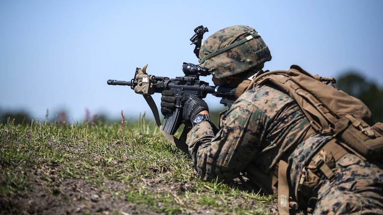 Lance Cpl. Michael A. Rosales, a machine gunner with Kilo Company, 3rd Battalion, 8th Marine Regiment, engages targets down range during a fire team attack exercise as part of the battalion field exercise at Marine Corps Base Camp Lejeune, North Carolina, April 26, 2016. The FEX, now in its final week of operations, previously tested Marines on basic infantry fundamentals such as patrolling and land navigation.