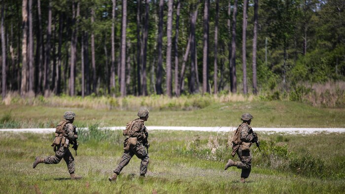 Marines with Kilo Company, 3rd Battalion, 8th Marine Regiment rush off of a training range during a fire-team attacks exercise as part of the battalion field exercise at Marine Corps Base Camp Lejeune, North Carolina, April 26, 2016. The unit is slated to conduct a training package at Marine Corps Mountain Warfare Training Center Bridgeport, Calif., in the coming months.