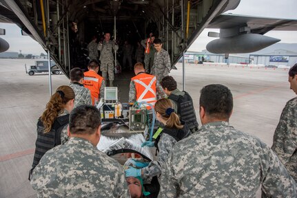 Critical Care Air Transport teams from the U.S. Air Force and Fuerza Aerea de Chile, load a mock patient onboard a C-130H2 aircraft belonging to the 136th Airlift Wing, Texas Air National Guard, during a medical air-evacuation exercise at Santiago, Chile, April 5, 2016. The one- day exercise involved Texas and Oklahoma Air National Guardsmen, active-duty USAF and Chilean air force medical teams as they collaborated and exchanged techniques for domestic operations during natural disasters.

