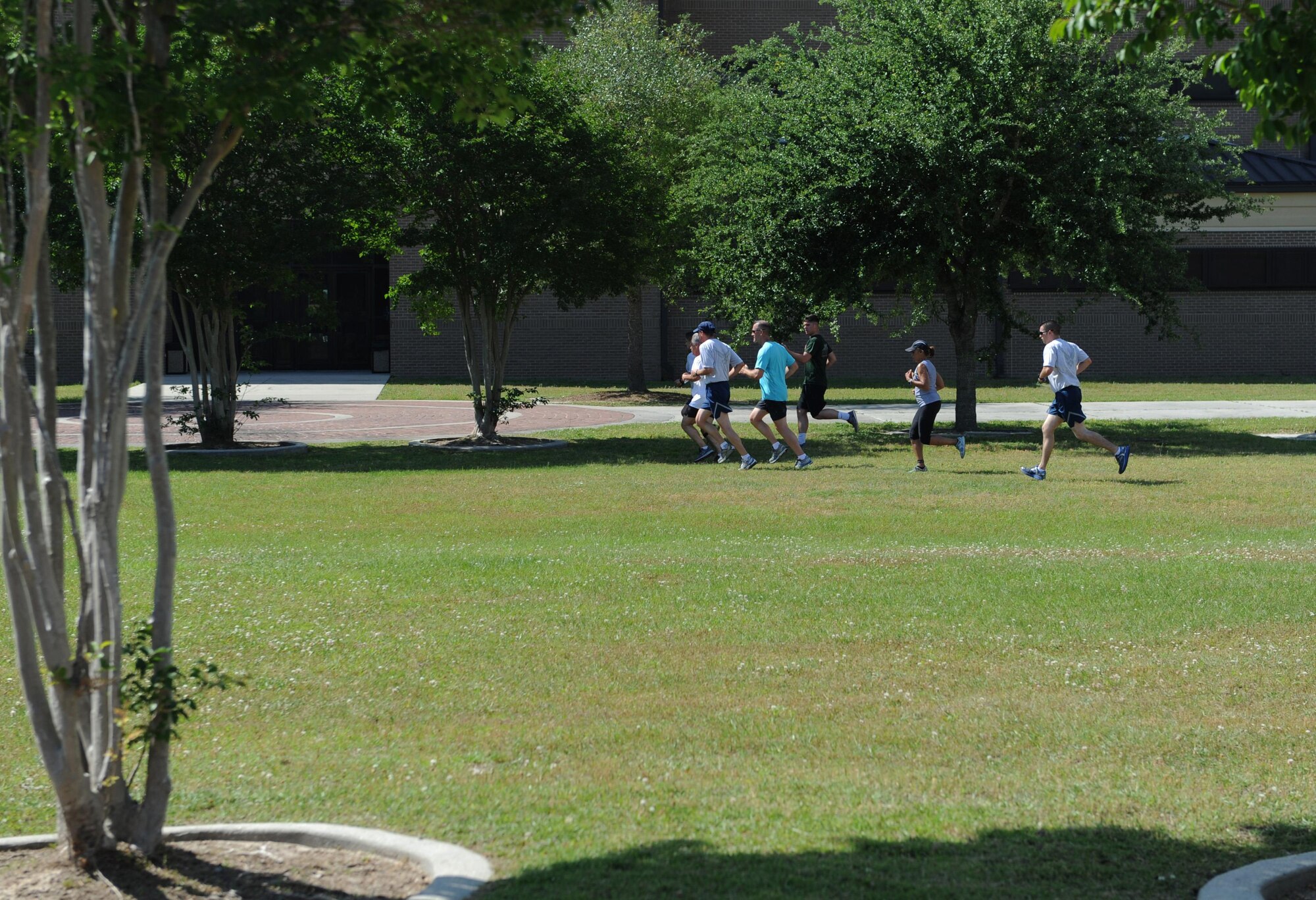 “Training Group-C” team members run towards their next clue in front of Matero Hall during the Wingman Week Heritage Hunt April 26, 2016, Keesler Air Force Base, Miss. The hunt, consisting of eight teams, was one of many events held throughout the week. The “Training Group-A” team was the winner of the event. (U.S. Air Force photo by Kemberly Groue)