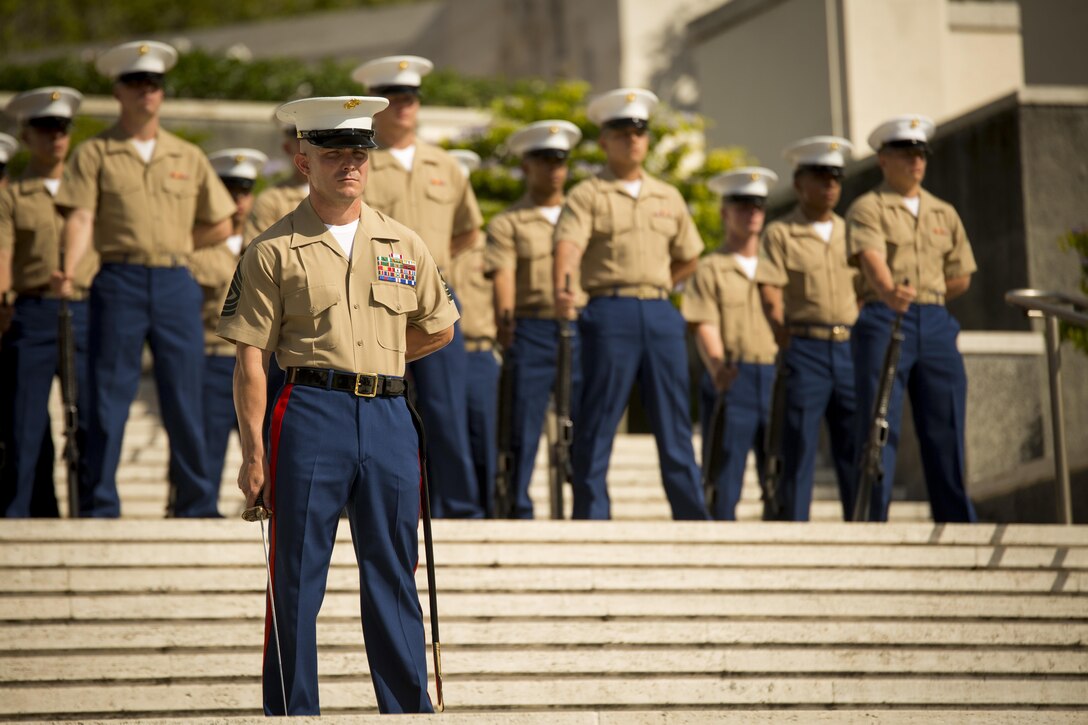 1st Sgt. Ray McGinnis stands at parade rest with the honor guard during the Australia New Zealand Army Corps Day ceremony held at the National Memorial Cemetery of the Pacific, April 25, 2016. McGinnis is the company first sergeant of 2nd Battalion, 3rd Marine Regiment, and led the honor guard throughout the ceremony. The U.S. Marine Corps and Australian Defence Forces share an enduring alliance through the Marine Rotational Force – Darwin, which deploys in a rotational manner for six months out of the year in Darwin, Australia. 