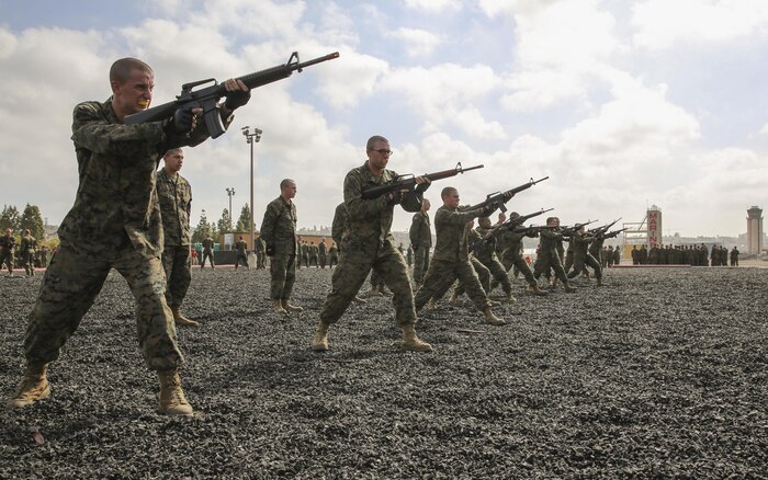 Recruits of Charlie Company, 1st Recruit Training Battalion, conduct straight thrusts during a Marine Corps Martial Arts Program Test at Marine Corps Recruit Depot San Diego, April 27. Twenty recruits at a time took the test as the instructors evaluated them on hand-to-hand combat techniques and various movements with knives and rifles. Annually, more than 17,000 males recruited from the Western Recruiting Region are trained at MCRD San Diego. Charlie Company is scheduled to graduate May 20.