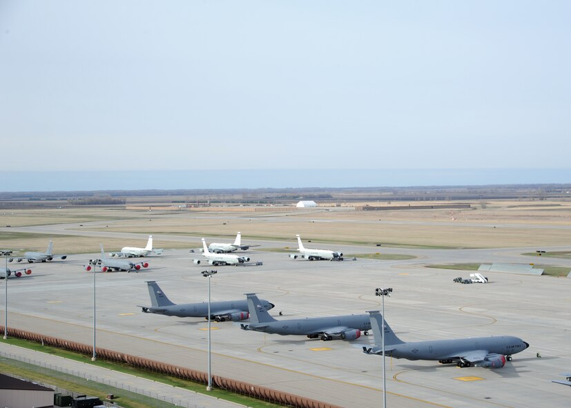 Several aircraft sit on the flight line April 27, 2016, on Grand Forks Air Force Base, N.D. The aircraft from Offutt Air Force Base, Neb., and McConnell Air Force Base, Kan., traveled to Grand Forks AFB to escape severe weather warnings at their bases. (U.S. Air Force photo by Airman 1st Class Ryan Sparks/Released)