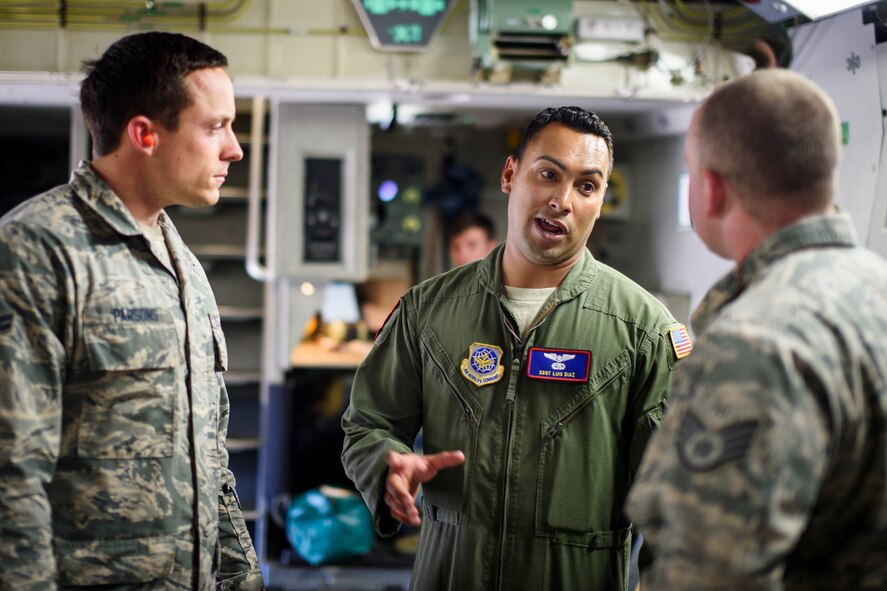 Staff Sgt. Luis Diaz, 15th Airlift Squadron loadmaster, briefs Airmen from the 1st Combat Camera Squadron about mission details April 25, 2016, on a C-17 Globemaster III at Joint Base Charleston – Air Base, S.C. The 437th Airlift Wing flew into Manta, Ecuador, in support of earthquake relief operations. Aboard the aircraft were Army personnel from the Contingency Response Group as well as equipment including a mobile control tower and a five-passenger vehicle. The 437th AW provides global reach airlift capability at any time to anywhere in the world. Whenever natural disasters occur, the 437th AW can provide humanitarian aid in a moment’s notice. (U.S. Air Force photo/Senior Airman Clayton Cupit)