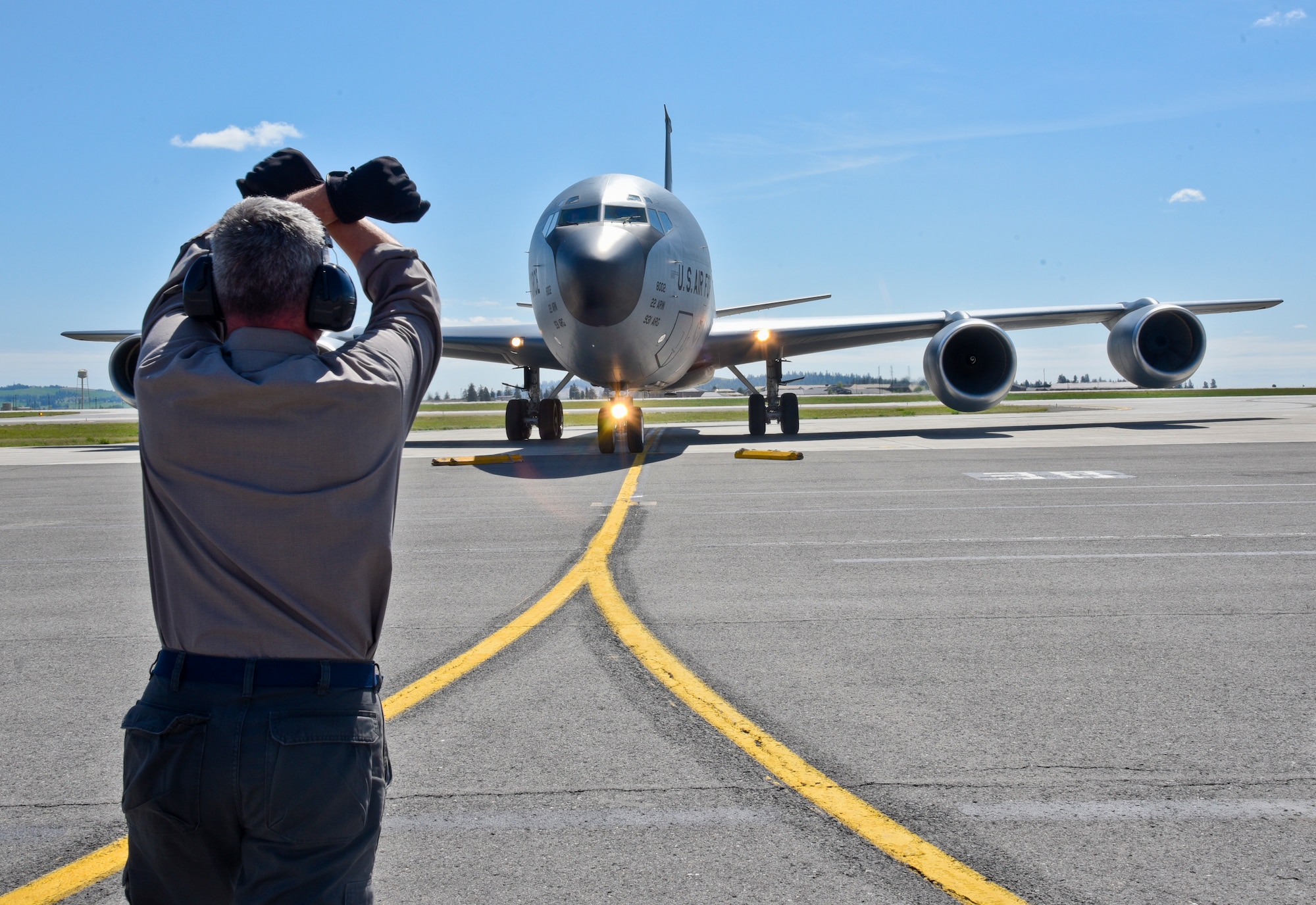 Kenneth Goulding, 92nd Maintenance Squadron transient alert aircraft servicer, taxis in a KC-135 Stratotanker from McConnell Air Force Base, Kan., April 26, 2016, at Fairchild AFB, Wash. Because of its ramp space, logistical capabilities, and maintenance facilities, Fairchild recieved six KC-135 Stratotankers that were evacuated from McConnell due to projected severe weather. (U.S. Air Force photo/Airman 1st Class Taylor Bourgeous) 