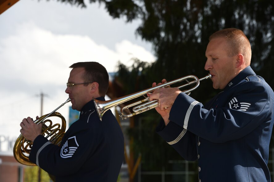 Master Sgt. Scott Wise (left), U.S. Air Force Band of the Golden West Travis Brass regional band craftsman arranger, and Staff Sgt. Jason Nickell, U.S. Air Force Band of the Golden West Travis Brass trumpet player, perform at Pioneer Park in Puyallup, Wash., April 24, 2016. The band’s mission is to honor, inspire and connect to the public. (U.S. Air Force photo/Staff Sgt. Naomi Shipley)
