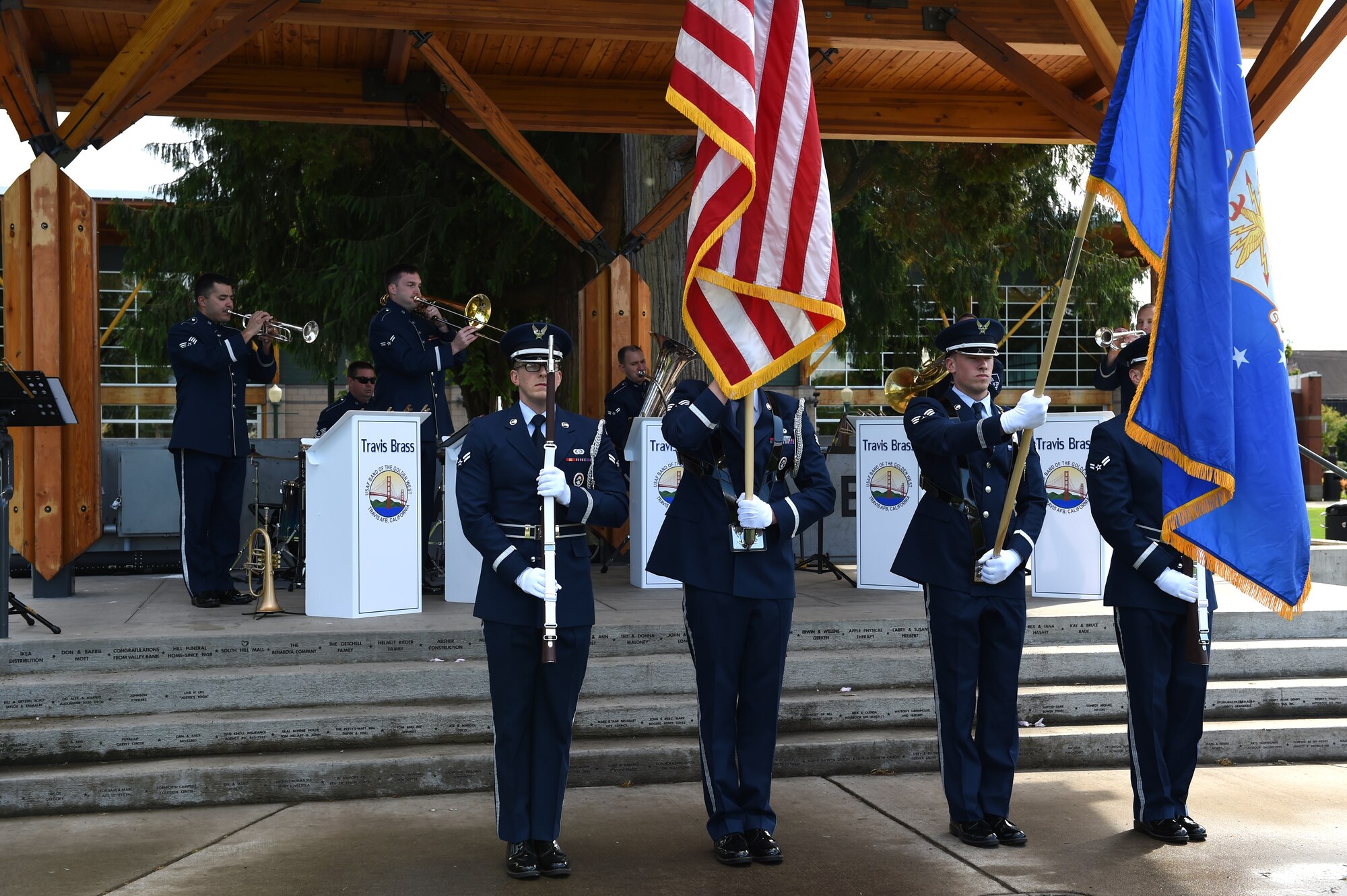 The Air Force Honor Guard from Joint Base Lewis-McChord presents the Colors at Pioneer Park in Puyallup, Wash., April 24, 2016. The honor guard supported the Travis Brass music performance to increase public understanding of the importance of airpower while enjoying a good music performance. (U.S. Air Force photo/Staff Sgt. Naomi Shipley)