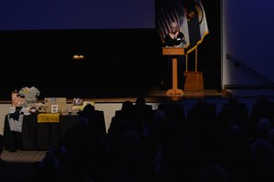 Deb Segaloff, holocaust commission member from the United Jewish Federation of Tidewater, tells the story of holocaust survivor Kitty Saks during the Holocaust Days of Remembrance ceremony at Fort Eustis, Va., April 20, 2016. Kitty survived the war by hiding her identity and living with a Catholic women’s convent until the end of the war, at which point she reunited with her family and moved to the U.S. (U.S. Air Force photo by Staff Sgt. Natasha Stannard) 