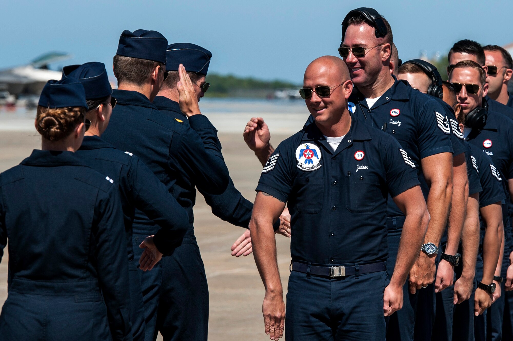 The U.S. Air Force Thunderbirds Show Line prepares for their performance with handshakes and salutes during the AirPower over Hampton Roads Open House at Langley Air Force Base, Va., April 24, 2016. Serving as Ambassadors in Blue, the USAF Thunderbirds is based out of Nellis Air Force Base, Nev. (U.S. Air Force photo by Airman 1st Class Derek Seifert) 