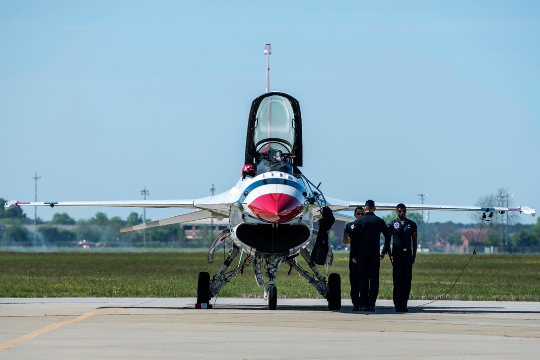 A U.S. Air Force Thunderbird pilot salutes maintenance members before boarding an F-16 Fighting Falcon at Langley Air Force Base, Va., April 24, 2016. The Thunderbirds headlined the AirPower over Hampton Roads Open House and performed precision aerial maneuvers, demonstrating the capabilities of the high performance aircraft to the Hampton Roads community. (U.S. Air Force photo by Airman 1st Class Derek Seifert)