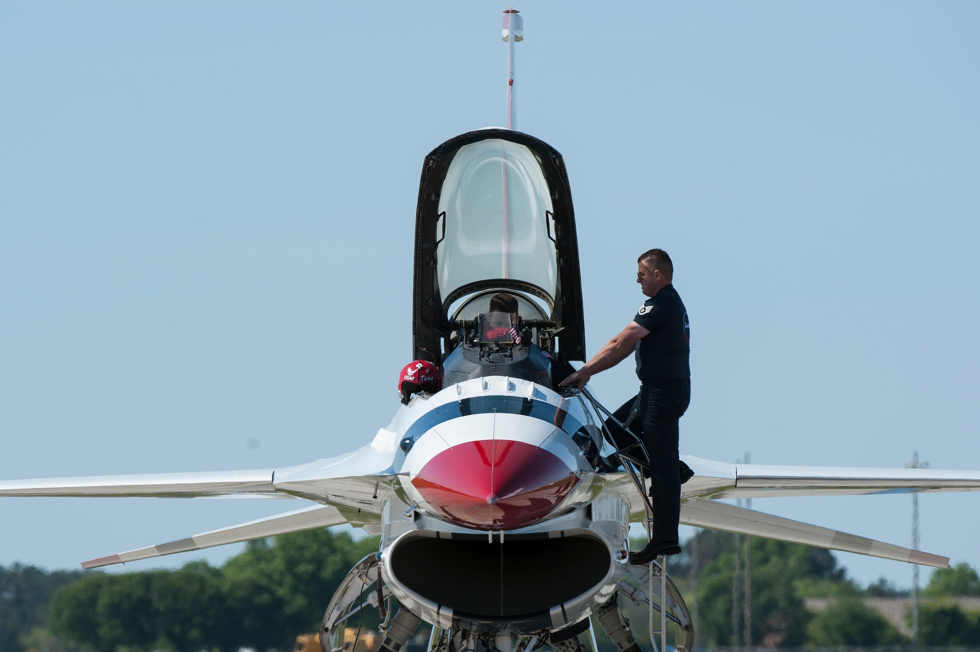 A U.S. Air Force Thunderbirds aerial demonstration team member performs a safety check during the AirPower over Hampton Roads Open House at Langley Air Force Base, Va., April 24, 2016. The Thunderbirds Show Line consists of 24 professionals in various aircraft maintenance specialties selected before each demonstration season based on their job proficiency, dedication to duty and overall attitude. (U.S. Air Force photo by Airman 1st Class Kaylee Dubois)