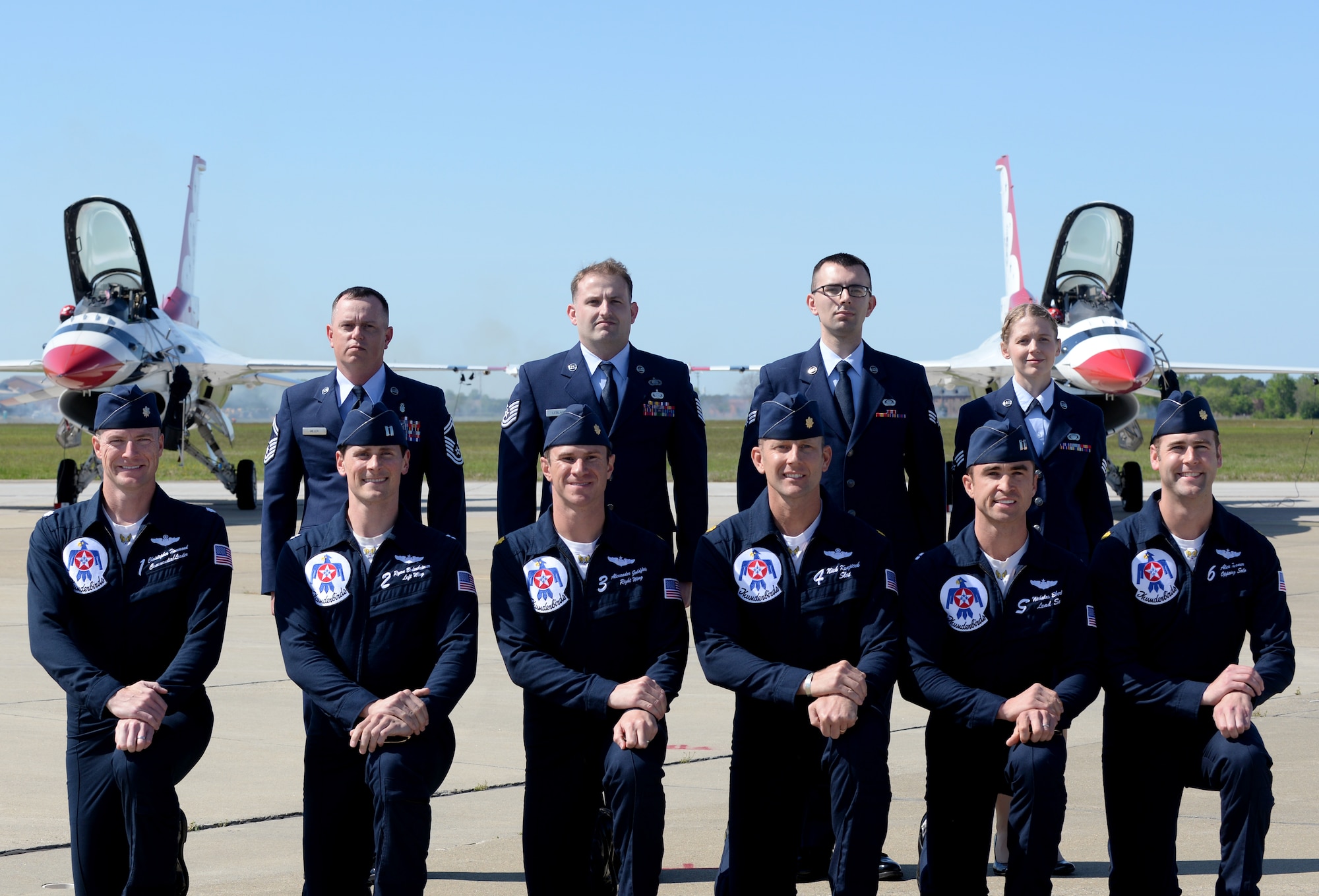 U.S. Airmen pose with members of the Thunderbirds aerial demonstration team during the AirPower over Hampton Roads Open House at Langley Air Force Base, Va., April 24, 2016. The four Airmen were honored for outstanding performance in their career fields. (U.S. Air Force photo by Airman 1st Class Kaylee Dubois)