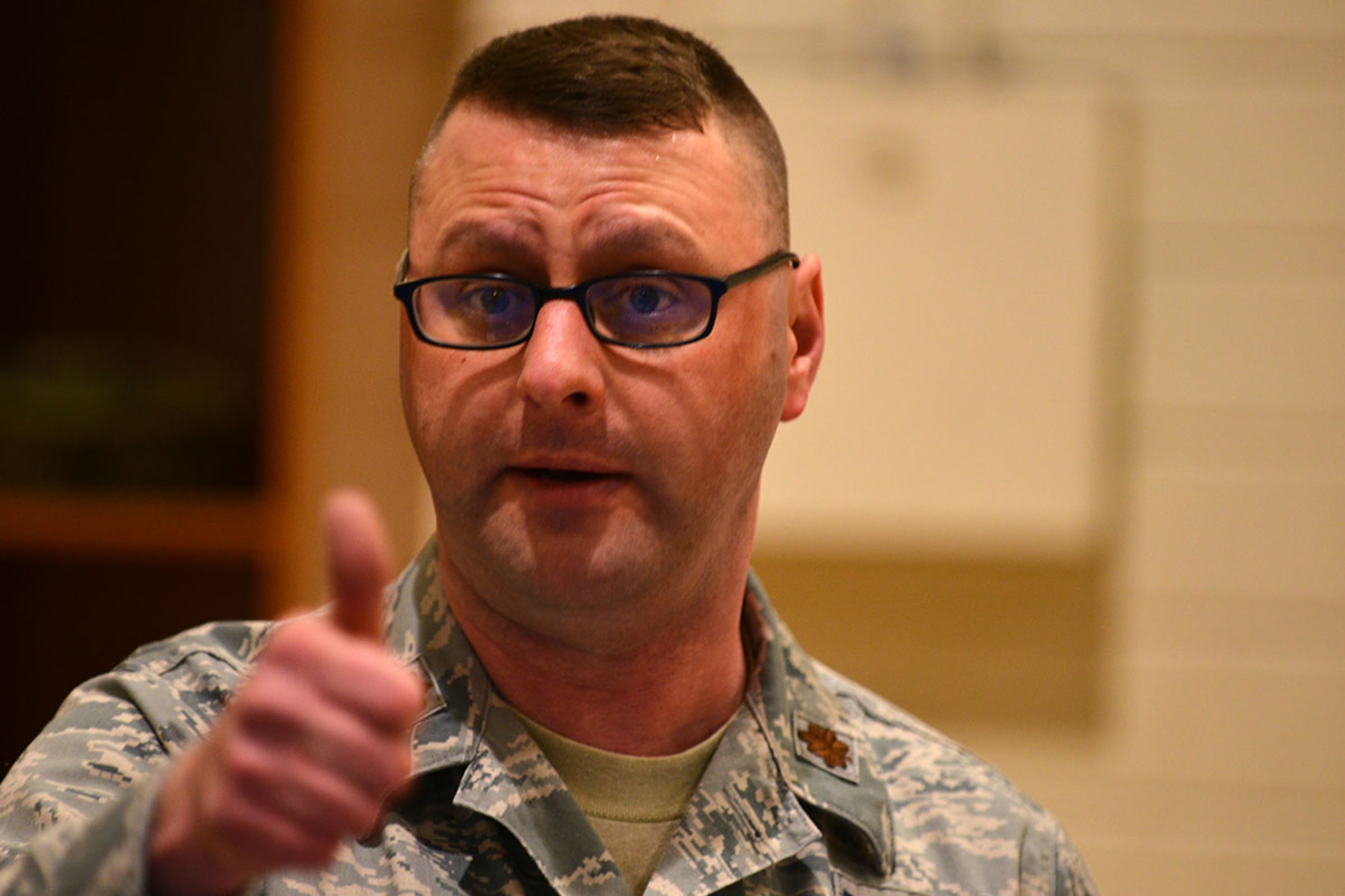 Air Force Maj. Stephen Shea, 673d Medical Group en-route patient staging system team chief gives a thumbs-up to his team at the 673d MDG’s first localized ERPSS training at the Elmendorf Physical Fitness Center April 21. The ERPSS is designed to act as a temporary staging location for patients the hospital does not have room for in the event of a major incident before being flown out of the area. (U.S. Air Force photo by Airman 1st Class Kyle Johnson)