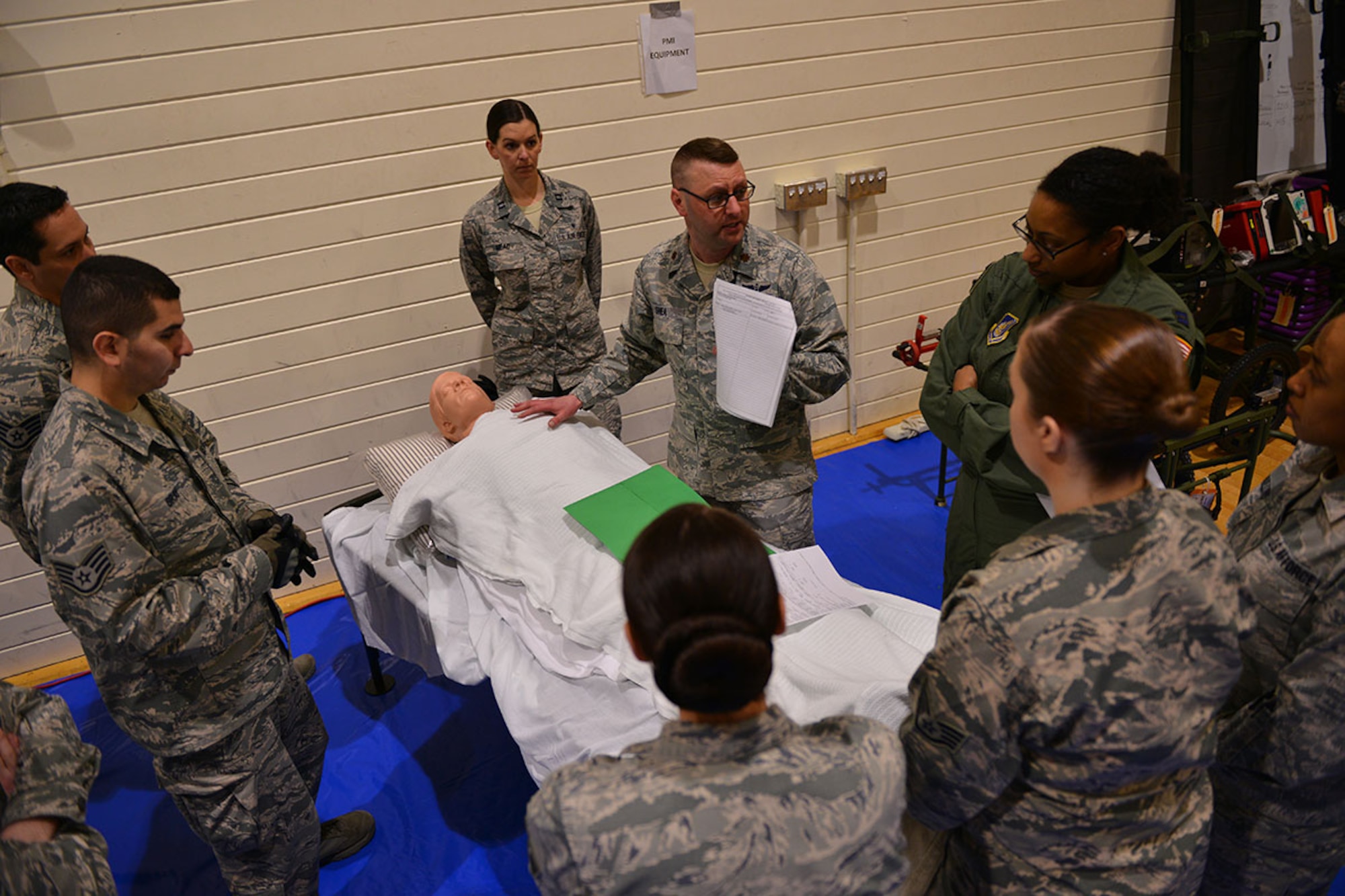 The 673d Medical Group personnel conduct their first localized en-route patient staging system training at the Elmendorf Physical Fitness Center April 21. The ERPSS is designed to act as a temporary staging location for patients the hospital does not have room for in the event of a major incident before being flown out of the area. (U.S. Air Force photo by Airman 1st Class Kyle Johnson)