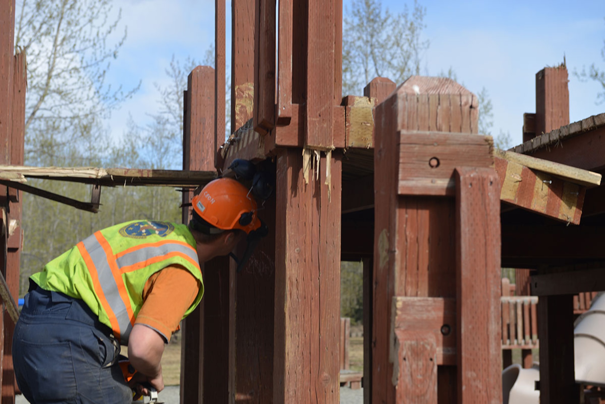 Levi Tressel, 773d Civil Engineer Squadron heavy equipment operator, inspects a play structure at the Cottonwood Park playground on Joint Base Elmendorf-Richardson, Alaska, April 26, 2016. Nine different play structures, laid in the shape of the Big Dipper, will be built to take the place of the old equipment. (U.S. Air Force photo by Airman 1st Class Javier Alvarez)