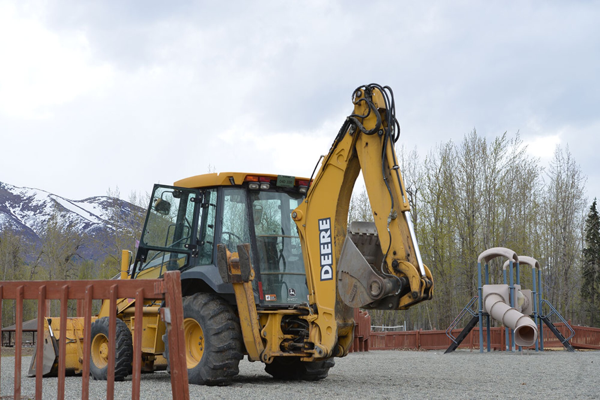 Heavy equipment is put in place as crews prepare for the demolition of the playground at Cottonwood Park, April 25, 2016.  Replacement play structures are military- and Alaska-inspired. (U.S. Air Force photo by Airman 1st Class Javier Alvarez)