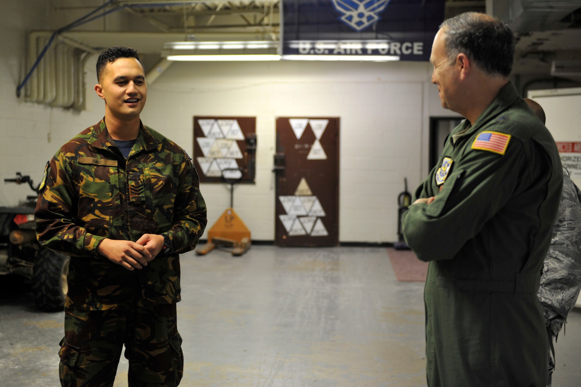 U.S. Air Force Maj. Gen. Jerry Martinez, Air Mobility Command Director of Operations, meets with Royal New Zealand Air Force SERE instructor Sgt. Ryan Turei, April 18, 2016, at Fort Polk, La., during Green Flag 16-06.  Turei worked with Little Rock AFB SERE specialist throughout the week sharing best practices from both countries.  The Royal Australian Air Force, Royal New Zealand Air Force and U.S. Air Force train during Green Flag Little Rock to ensure all aircrew can effectively communicate. (U.S. Air Force photo by Staff Sgt. Jeremy McGuffin)
