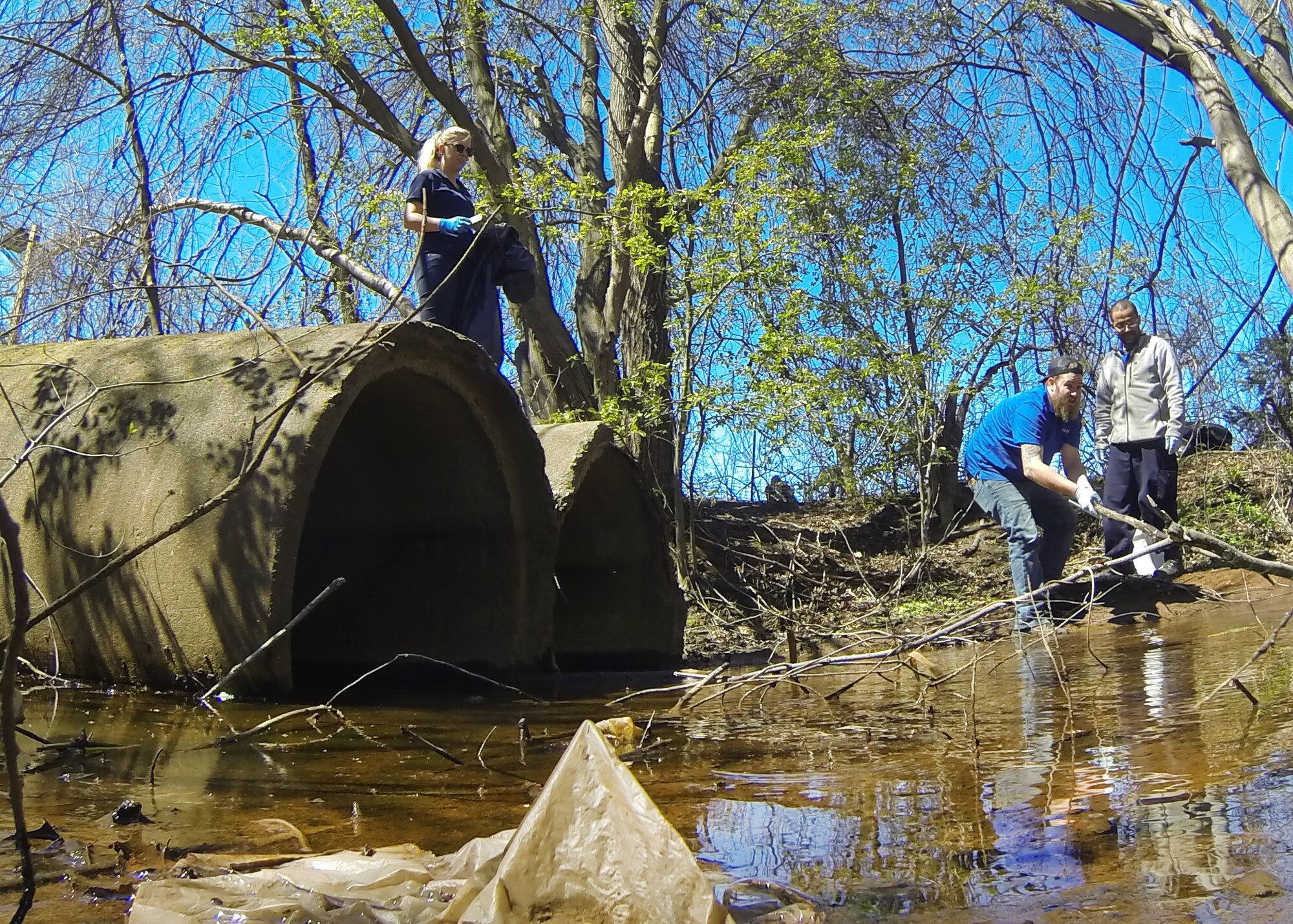 Volunteers remove trash from the Shawsheen River during an Earth Day River Cleanup project at Hanscom Air Force Base, Mass., April 27. Several volunteers from the base community, as well as sixth grade students from the Hanscom Middle School, participated in the Earth Day initiative organized by the 66th Civil Engineering Division’s Environmental Office. (U.S. Air Force photo by Mark Herlihy)