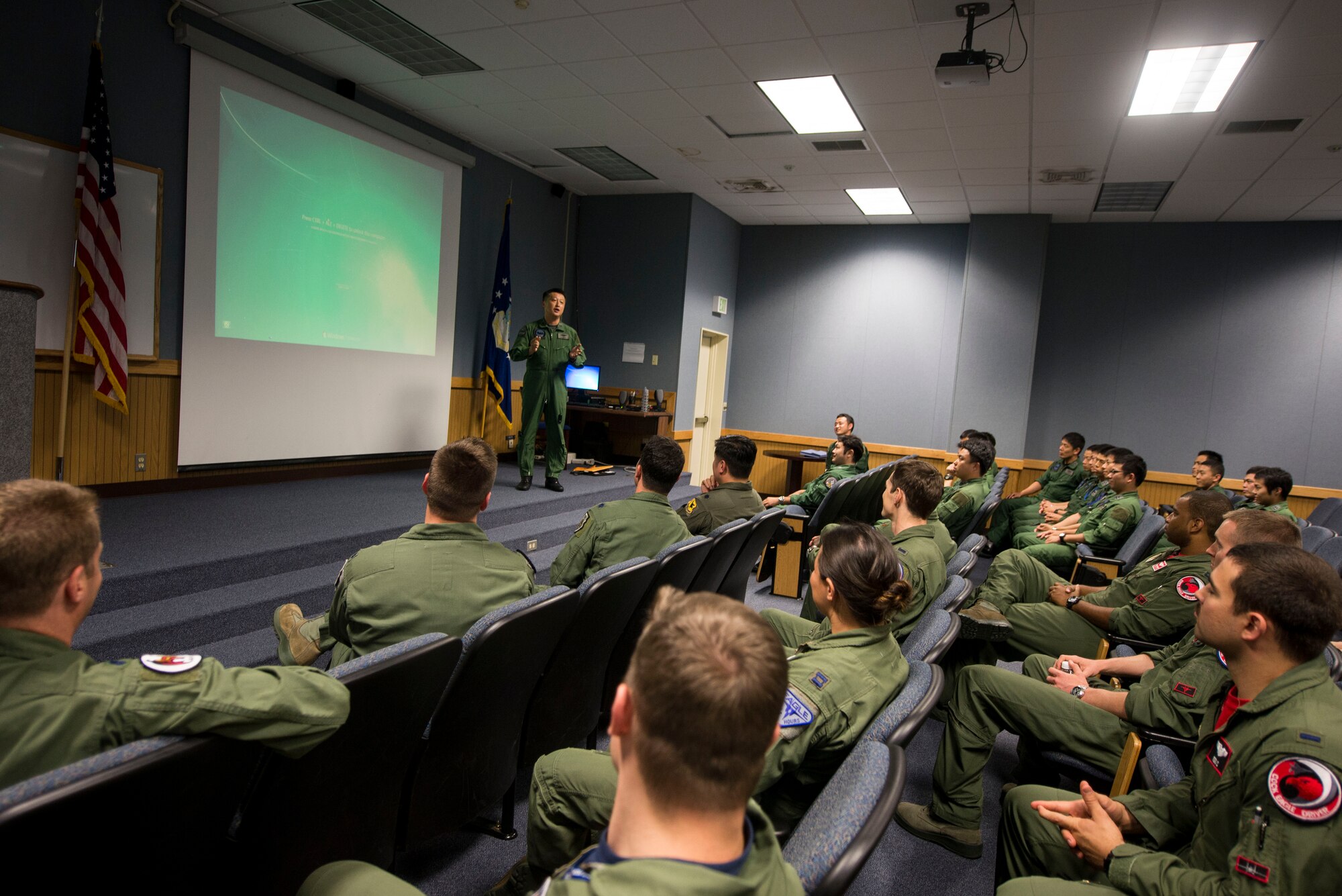 Japan Air Self-Defense Force Lt. Col. Kaoru Sato, Southwestern Air Composite 304th Squadron commander, speaks to U.S. Air Force 44th Fighter Squadron fighter pilots during an integration tour April 22, 2016, at Kadena Air Base, Japan. The integration tour was part of an ongoing initiative to increase interoperability with Kadena Air Base’s 44th Fighter Squadron and Naha Air Base’s 304th Fighter Squadron. (U.S. Air Force photo by Senior Airman Omari Bernard) 