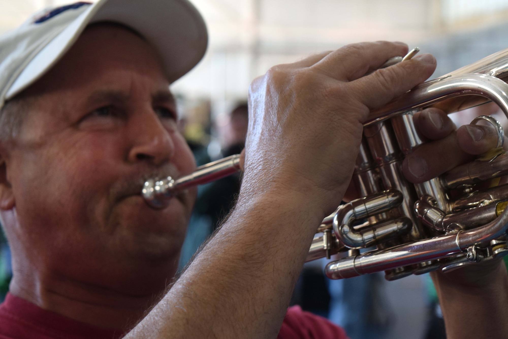 Lancers Alumni Drum and Bugle Corps’ Chuck Wilson, throttles the notes as a soprano bugle player during a unique practice session the 80 member band experienced at the Horsham Air Guard Station in Horsham Pa. on April 23. Hosted by the 111ATKW, the Hanover, Pa. band stopped on route to practice in one of the base’s former fighter aircraft hangars before a scheduled performance in Burlington, N.J. later that evening. (U.S. Air National Guard photo by Master Sgt. Christopher Botzum)