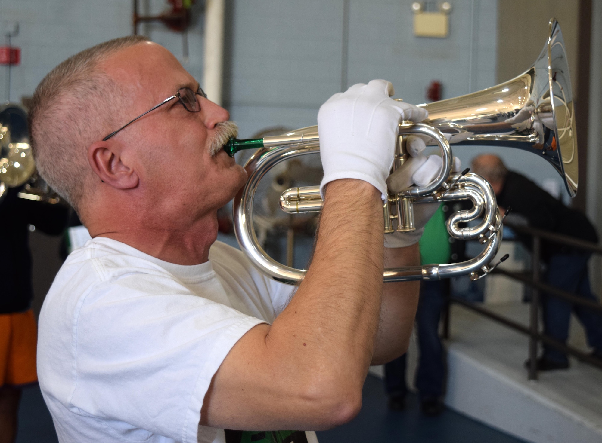 Lancers Alumni Drum and Bugle Corps’ Tom Ackman, solos as a Mellophone player during a unique practice session the 80 member band experienced at the Horsham Air Guard Station in Horsham Pa. on April 23. Hosted by the 111ATKW, the Hanover, Pa. band stopped on route to practice in one of the base’s former fighter aircraft hangars before a scheduled performance in Burlington, N.J. later that evening. (U.S. Air National Guard photo by Master Sgt. Christopher Botzum)